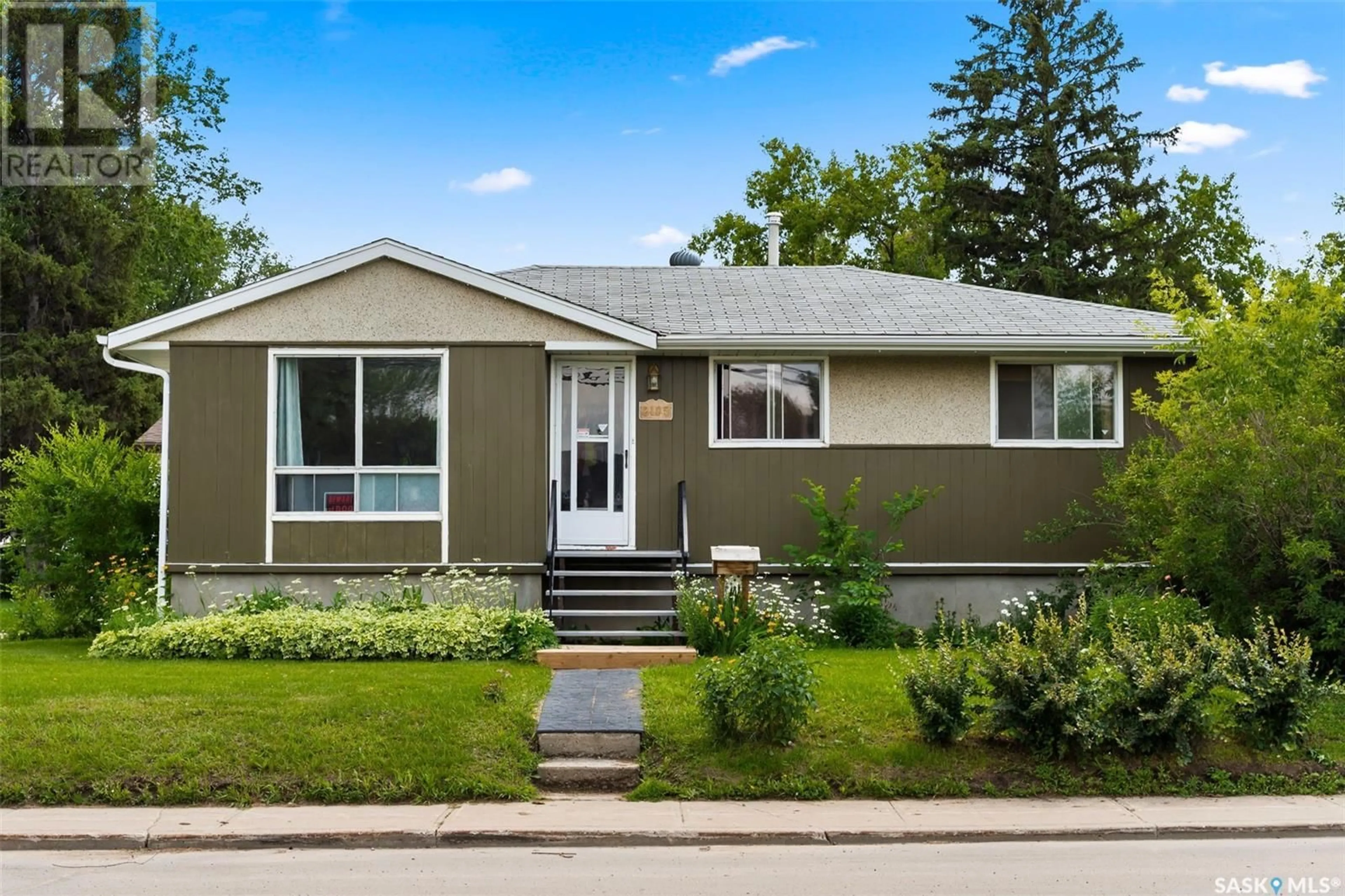 Home with vinyl exterior material for 2105 5th AVENUE N, Regina Saskatchewan S4R0R9
