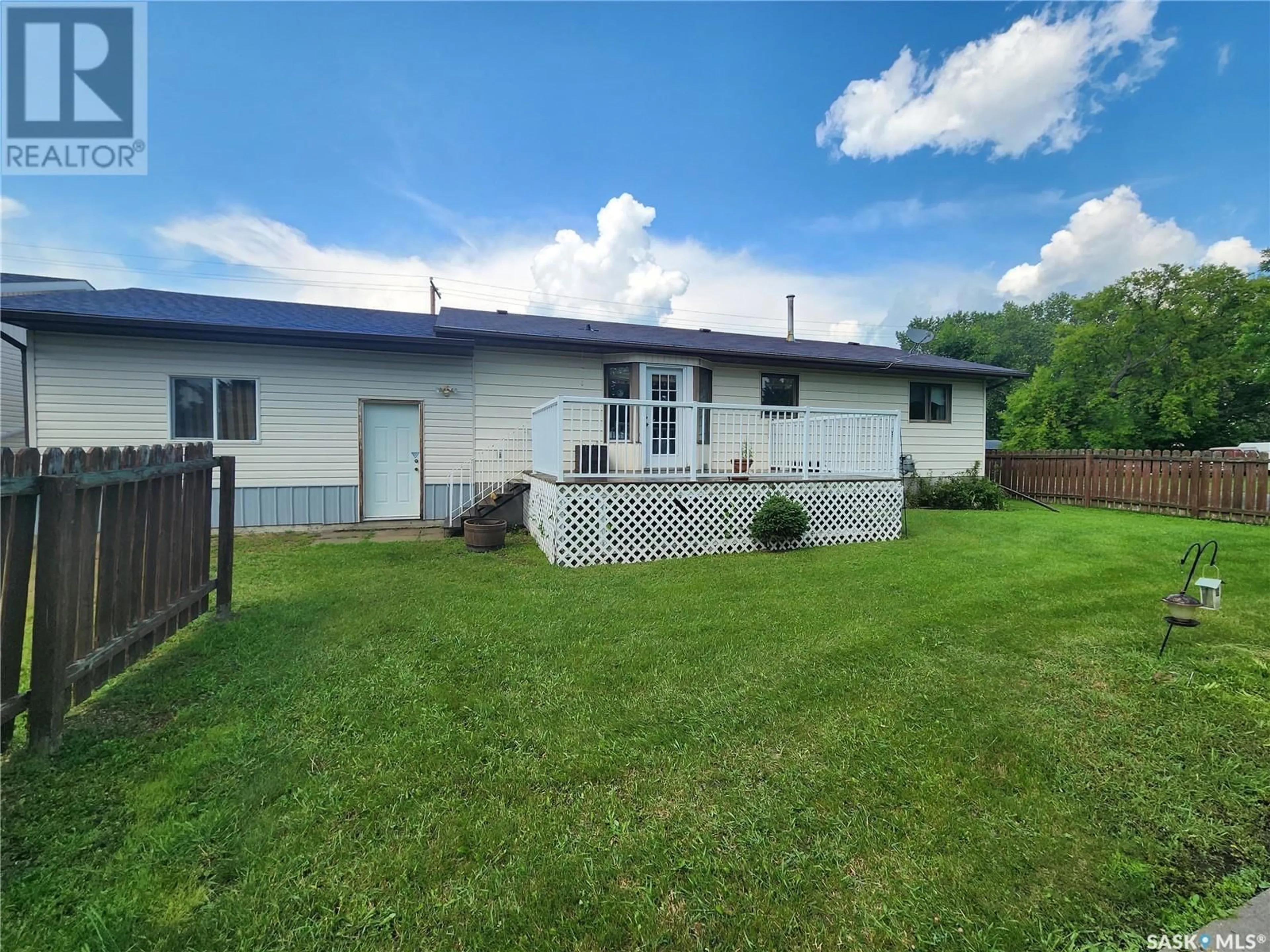 Frontside or backside of a home, the fenced backyard for 403 Calgary STREET, Broadview Saskatchewan S0G2B0