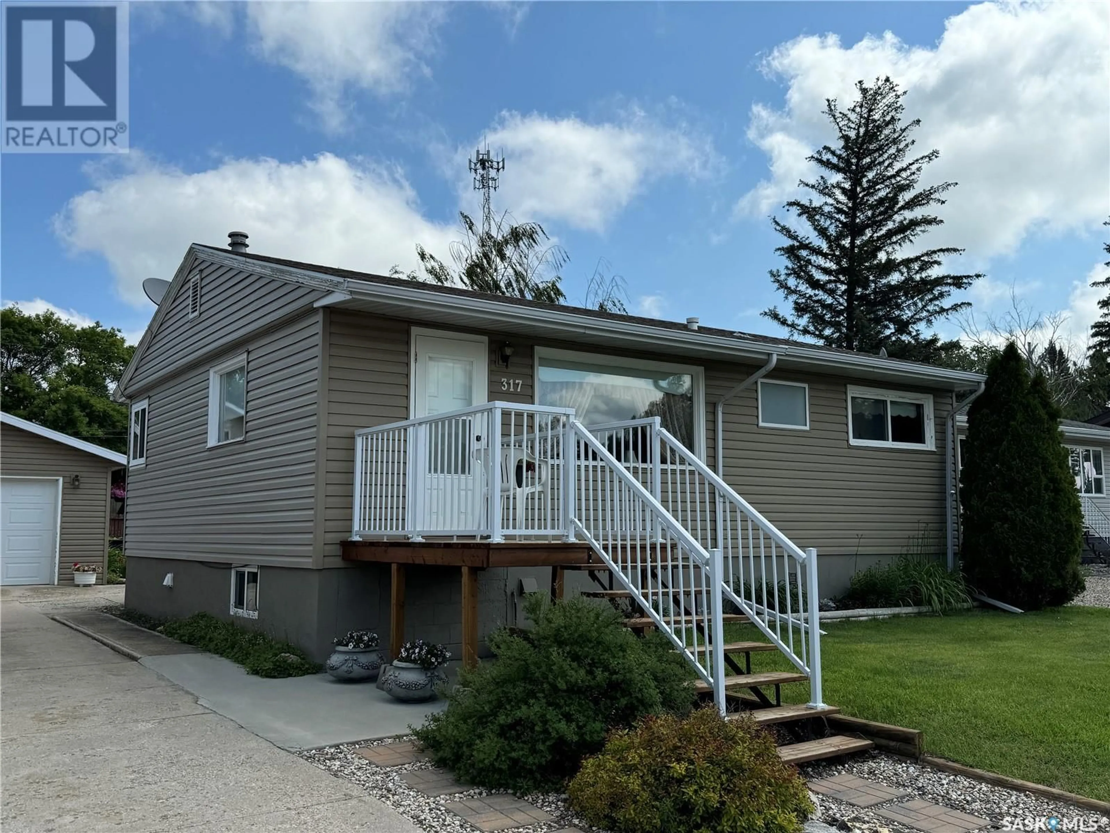 Frontside or backside of a home for 317 7th AVENUE W, Biggar Saskatchewan S0K0M0