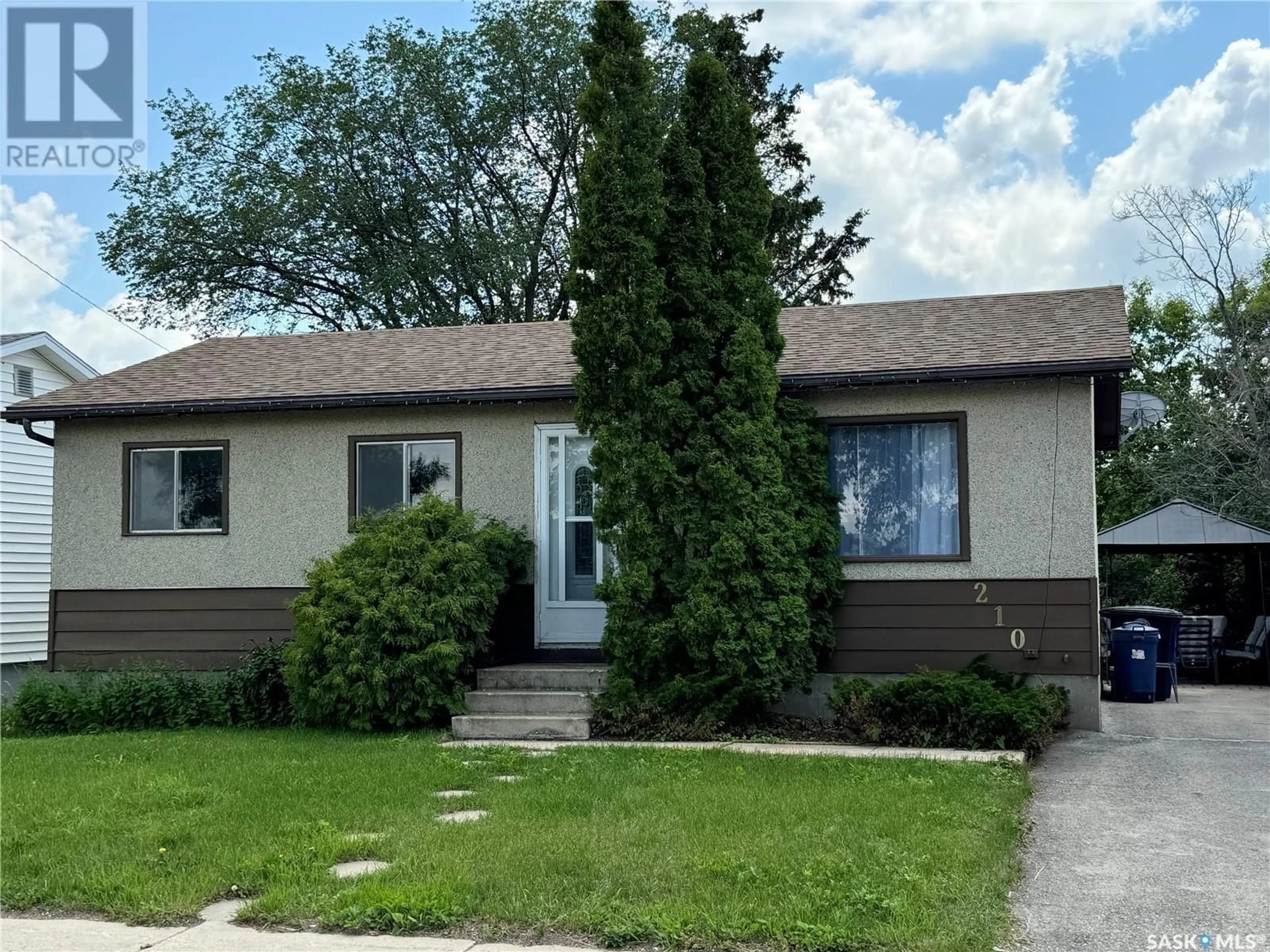 Frontside or backside of a home for 210 6th AVENUE E, Biggar Saskatchewan S0K0M0