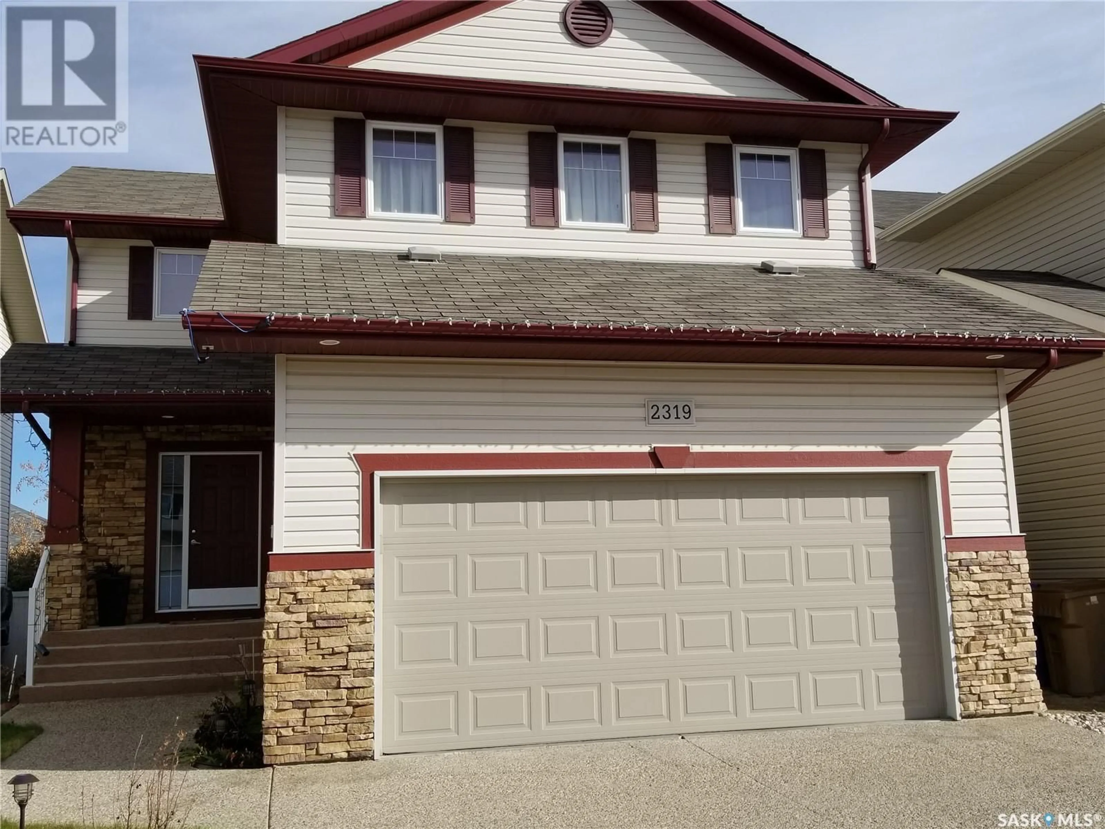 Home with vinyl exterior material for 2319 Riverbend CRESCENT, Regina Saskatchewan S4V1G5