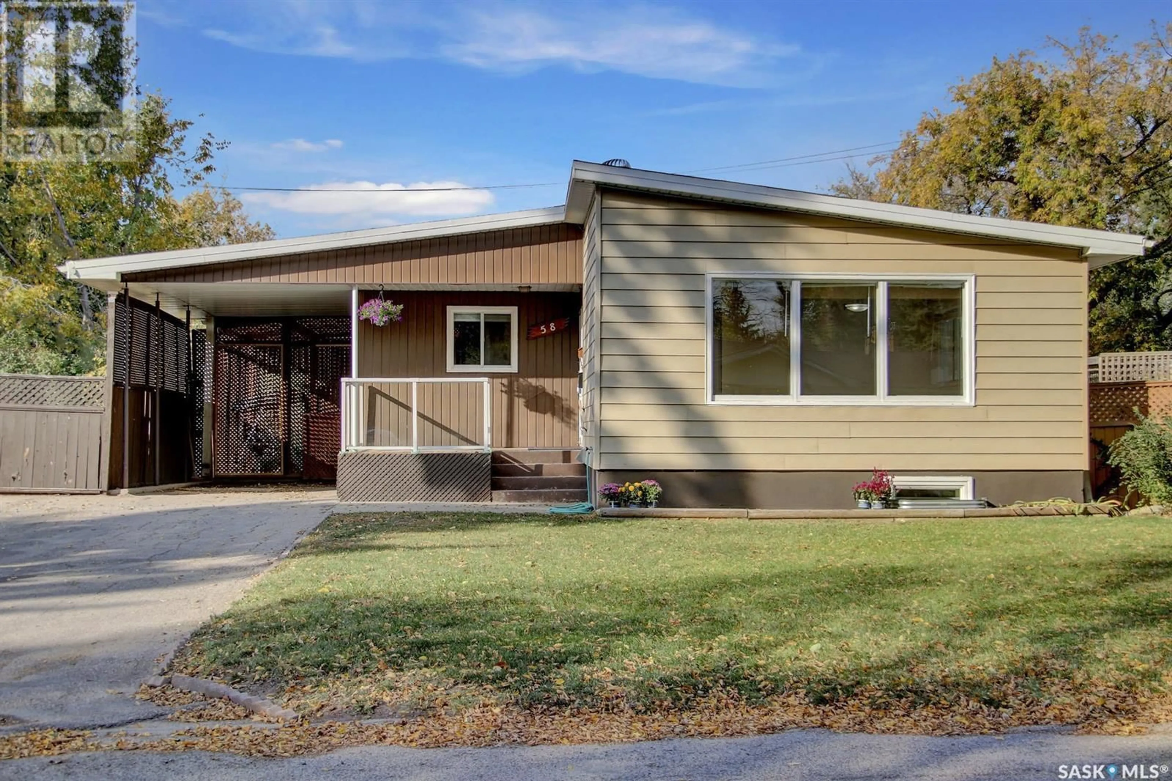 Home with vinyl exterior material for 58 Langley STREET, Regina Saskatchewan S4S3V6