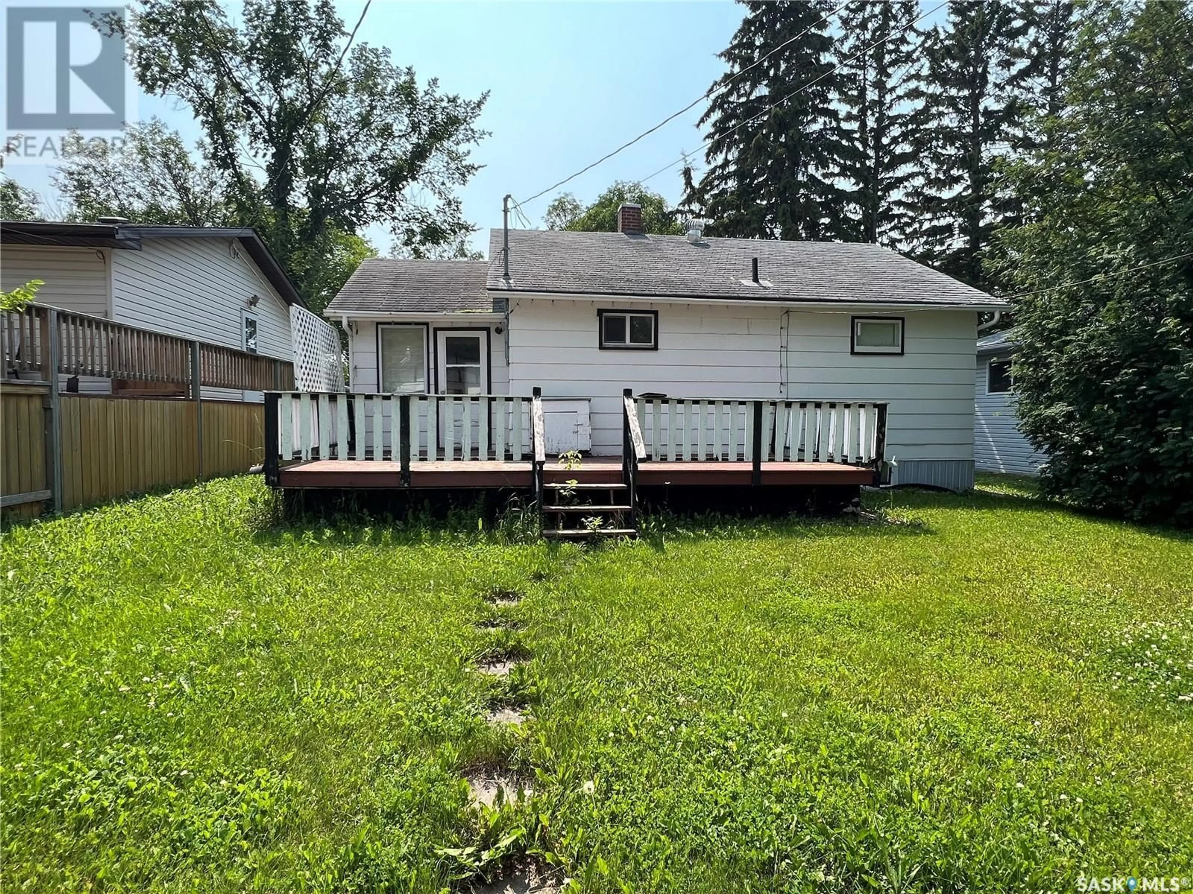 Frontside or backside of a home, the fenced backyard for 404 Macleod AVENUE E, Melfort Saskatchewan S0E1A0