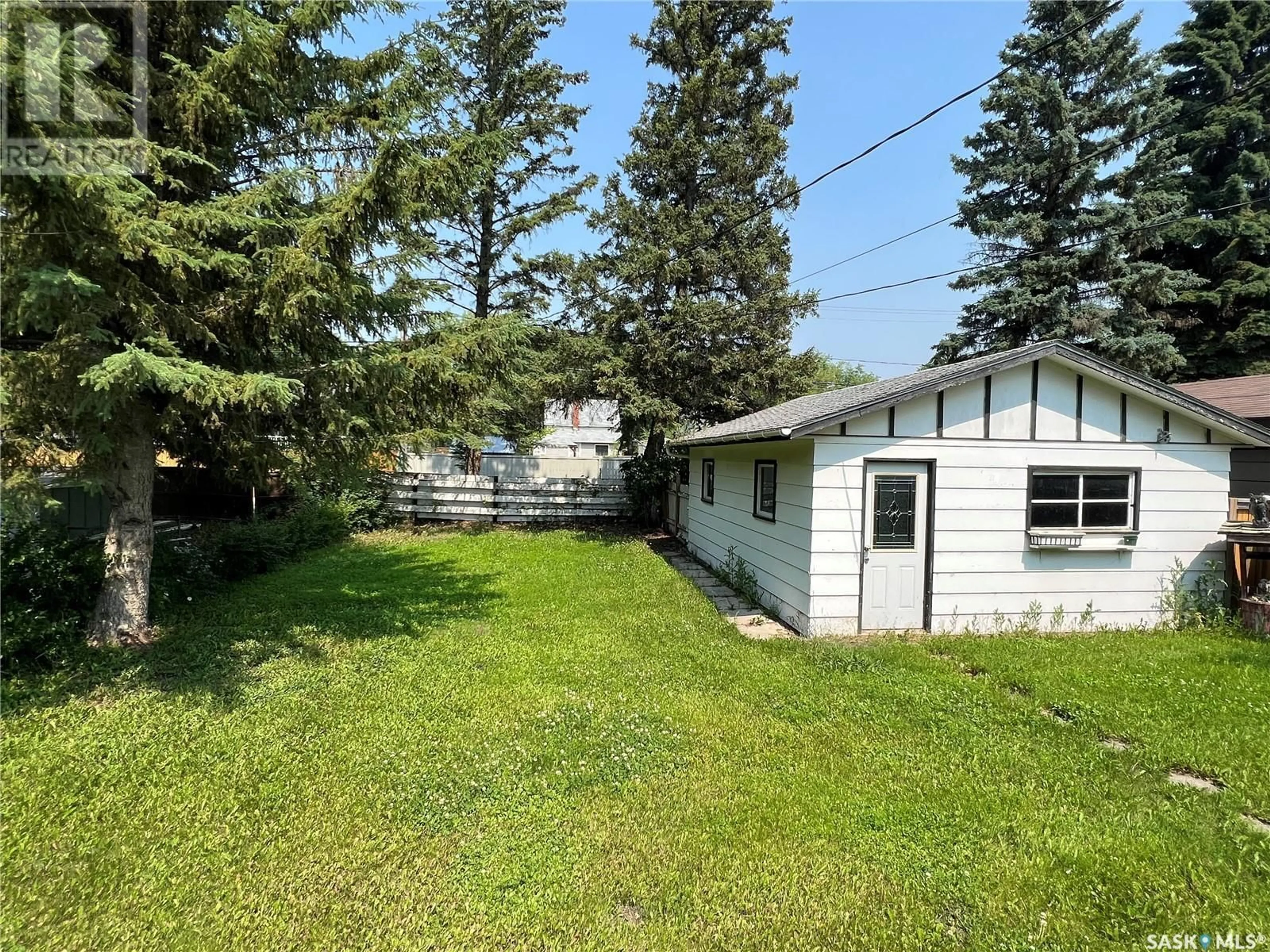 Frontside or backside of a home, the fenced backyard for 404 Macleod AVENUE E, Melfort Saskatchewan S0E1A0