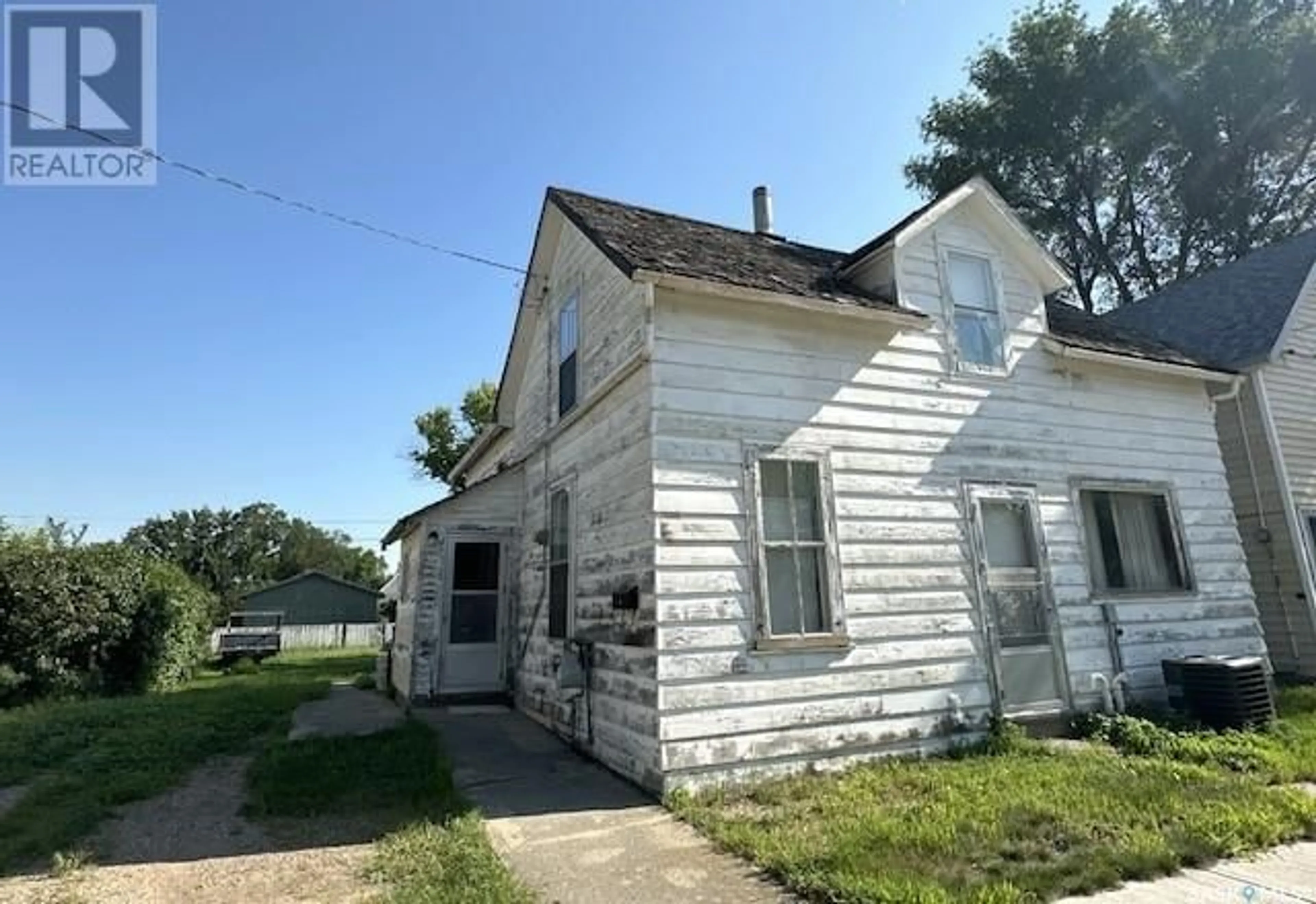 Frontside or backside of a home, the front or back of building for 19 3rd AVENUE SE, Weyburn Saskatchewan S4H1X2