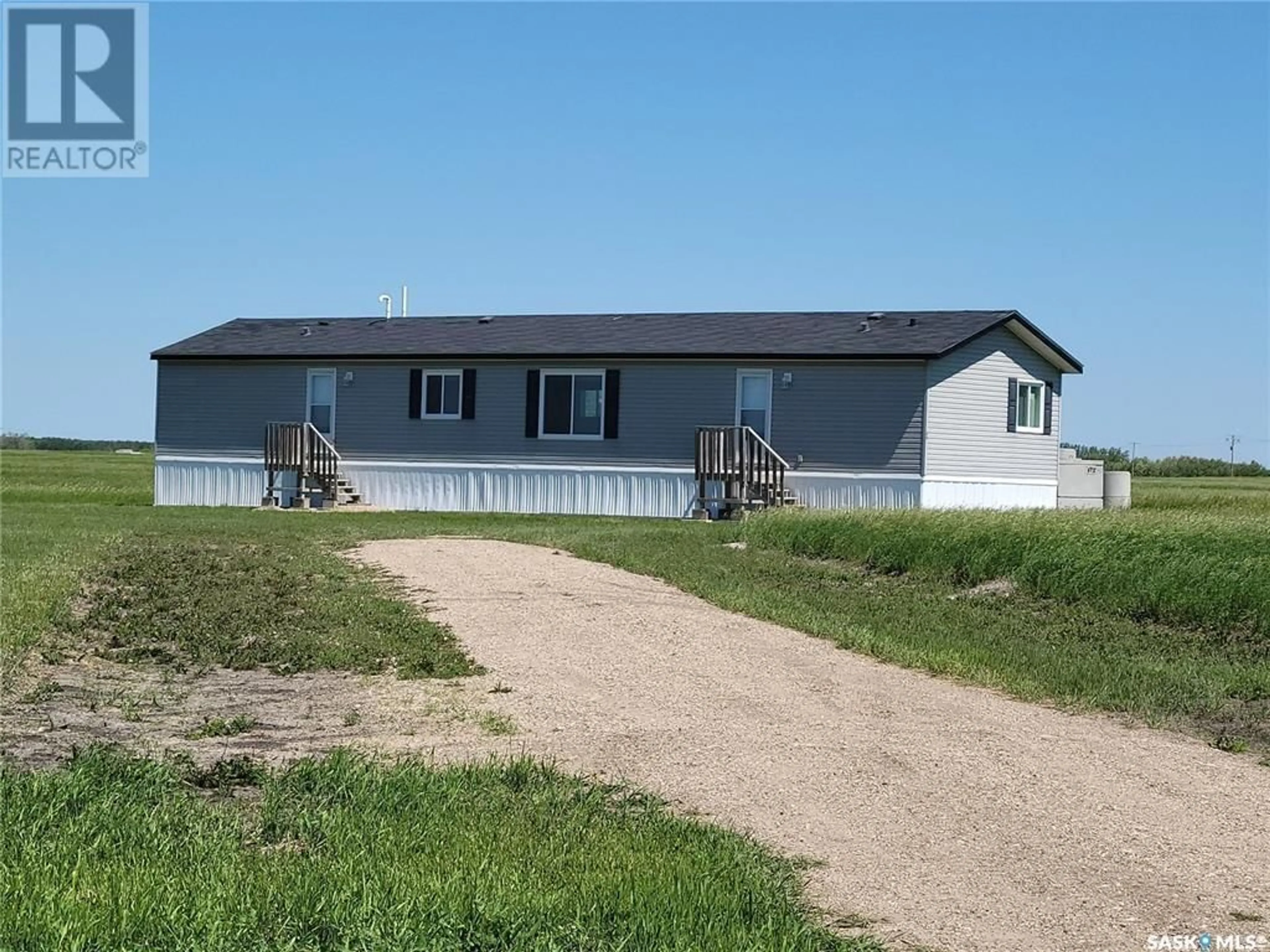 Home with vinyl exterior material for CND Acreage #1, Saltcoats Rm No. 213 Saskatchewan S0A3R0