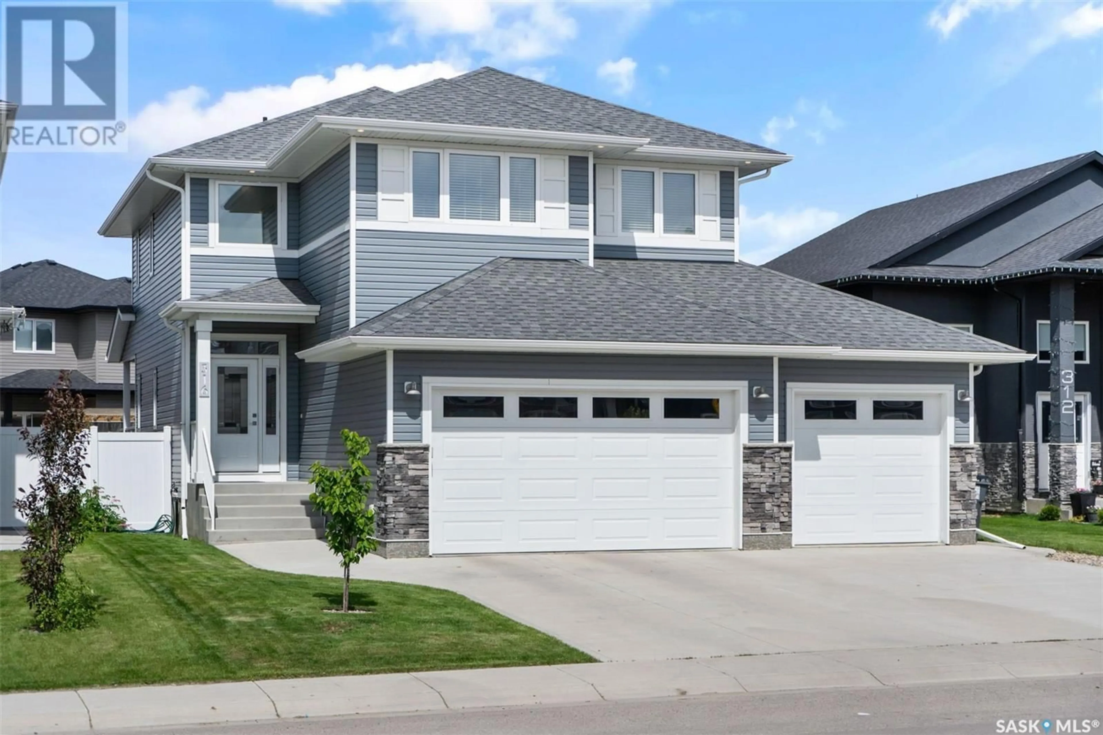 Frontside or backside of a home for 316 Bolstad WAY, Saskatoon Saskatchewan S7W0Y1