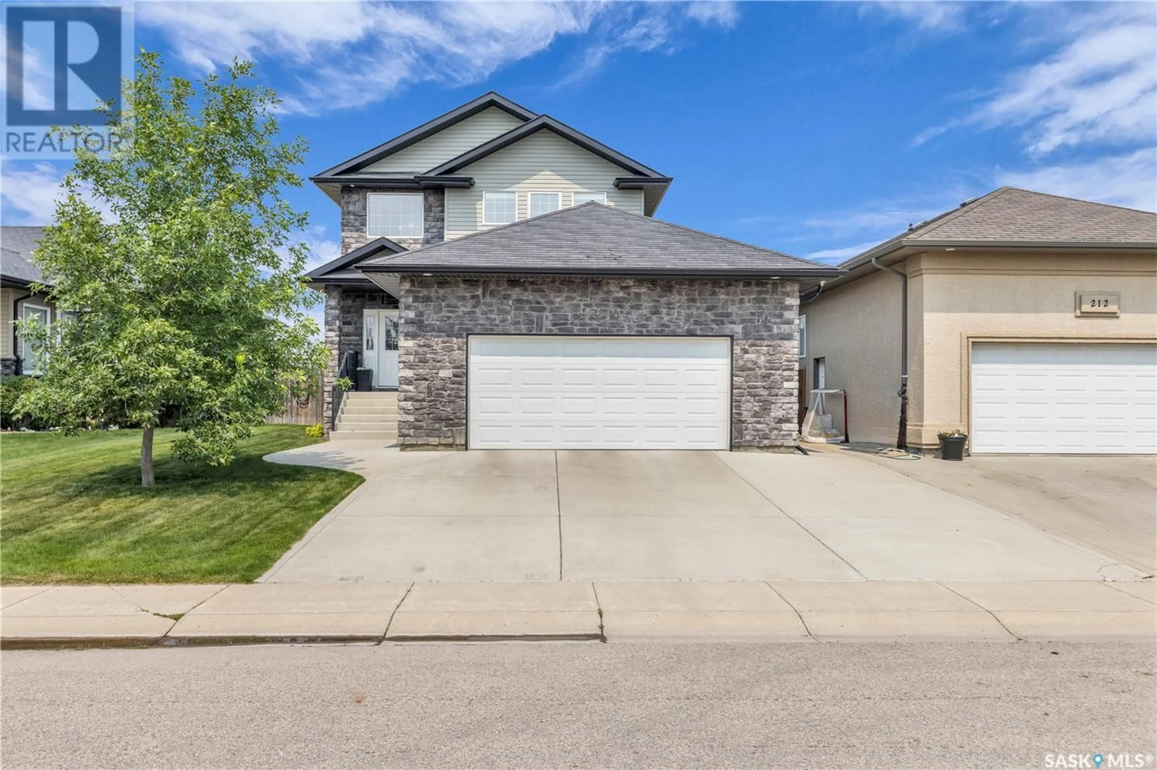 Frontside or backside of a home for 210 Crenshaw WAY, Warman Saskatchewan S0K4S1