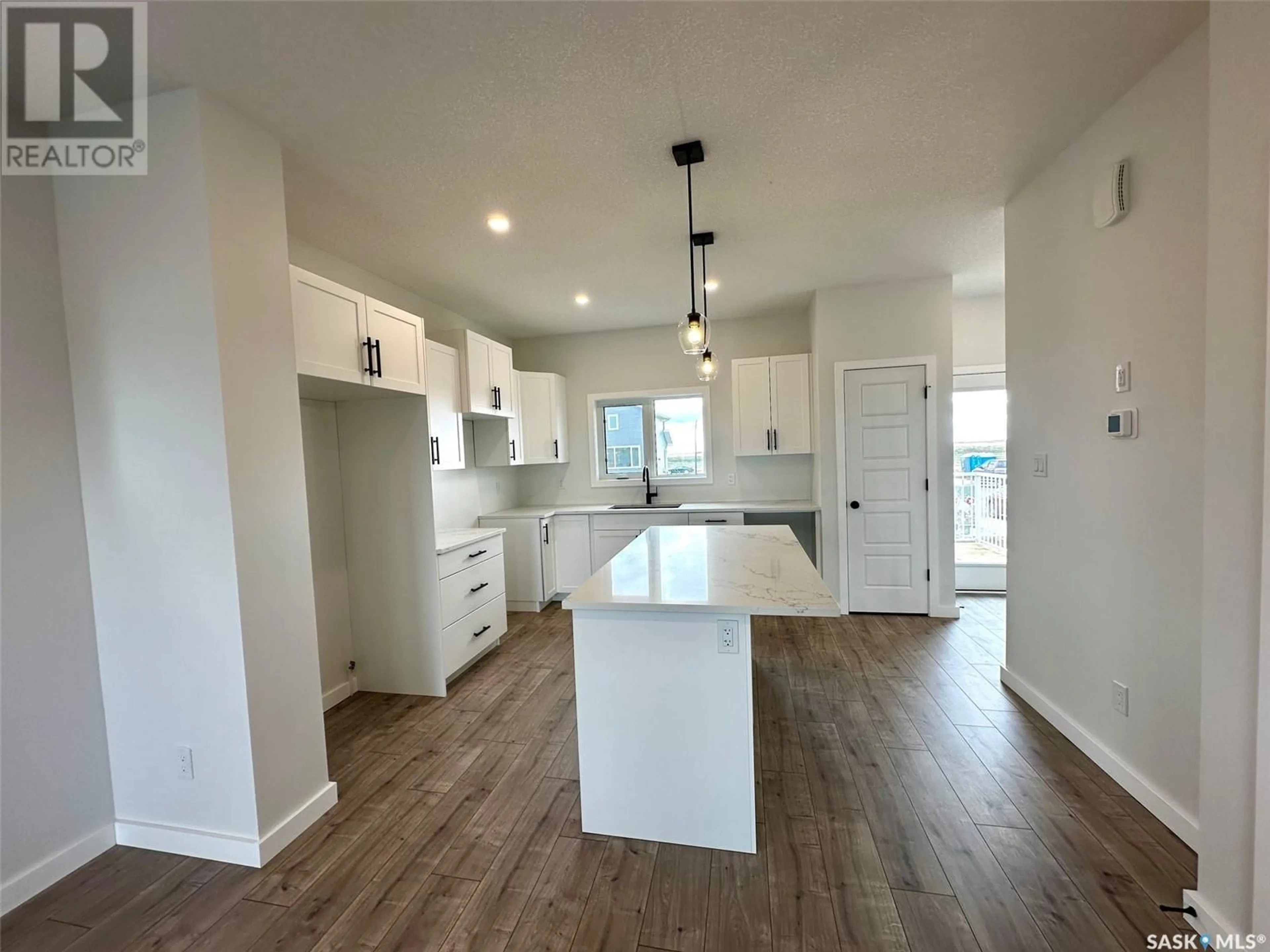 Open concept kitchen for 1127 Camden GARDENS, White City Saskatchewan S4L3R5