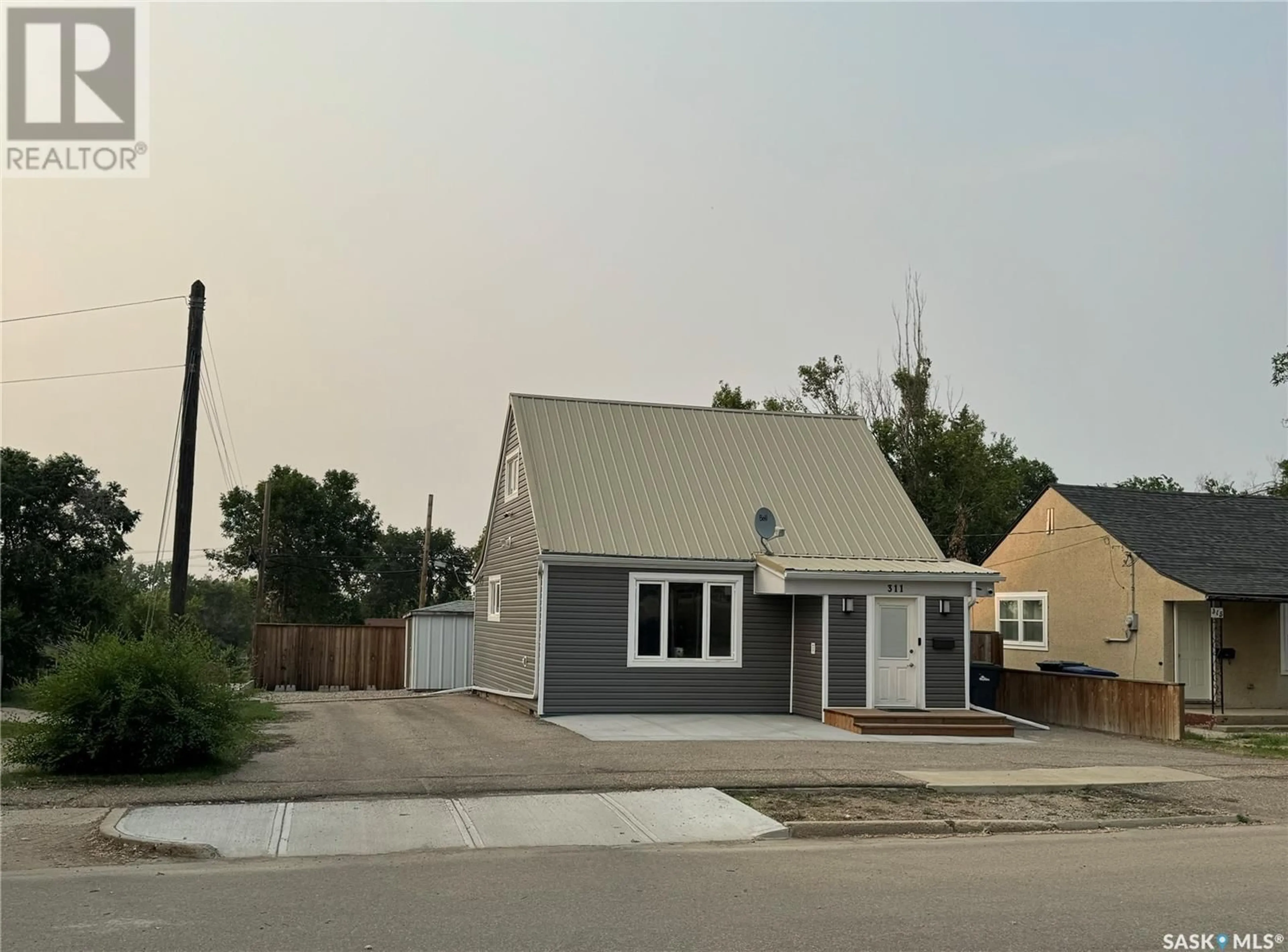 Frontside or backside of a home for 311 5th AVENUE SE, Weyburn Saskatchewan S4H1Y4