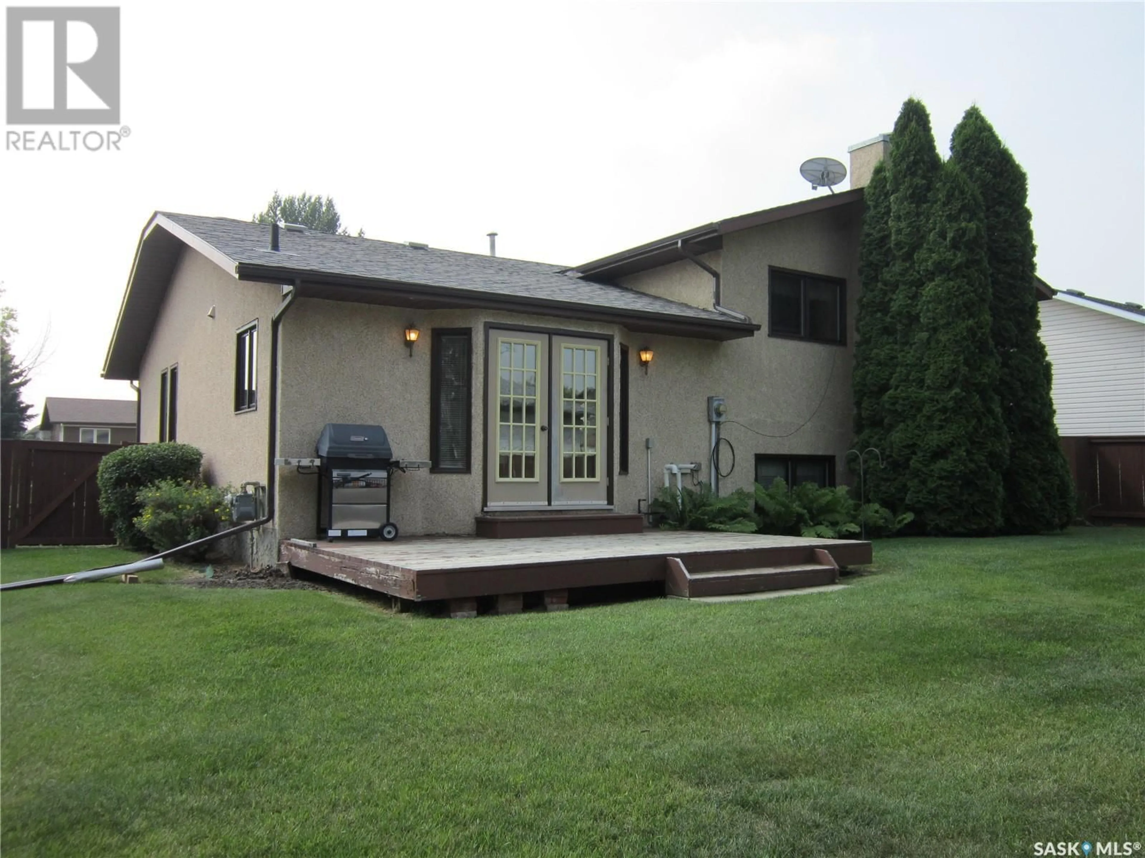 Frontside or backside of a home, the fenced backyard for 27 Groat DRIVE, Melfort Saskatchewan S0E1A0