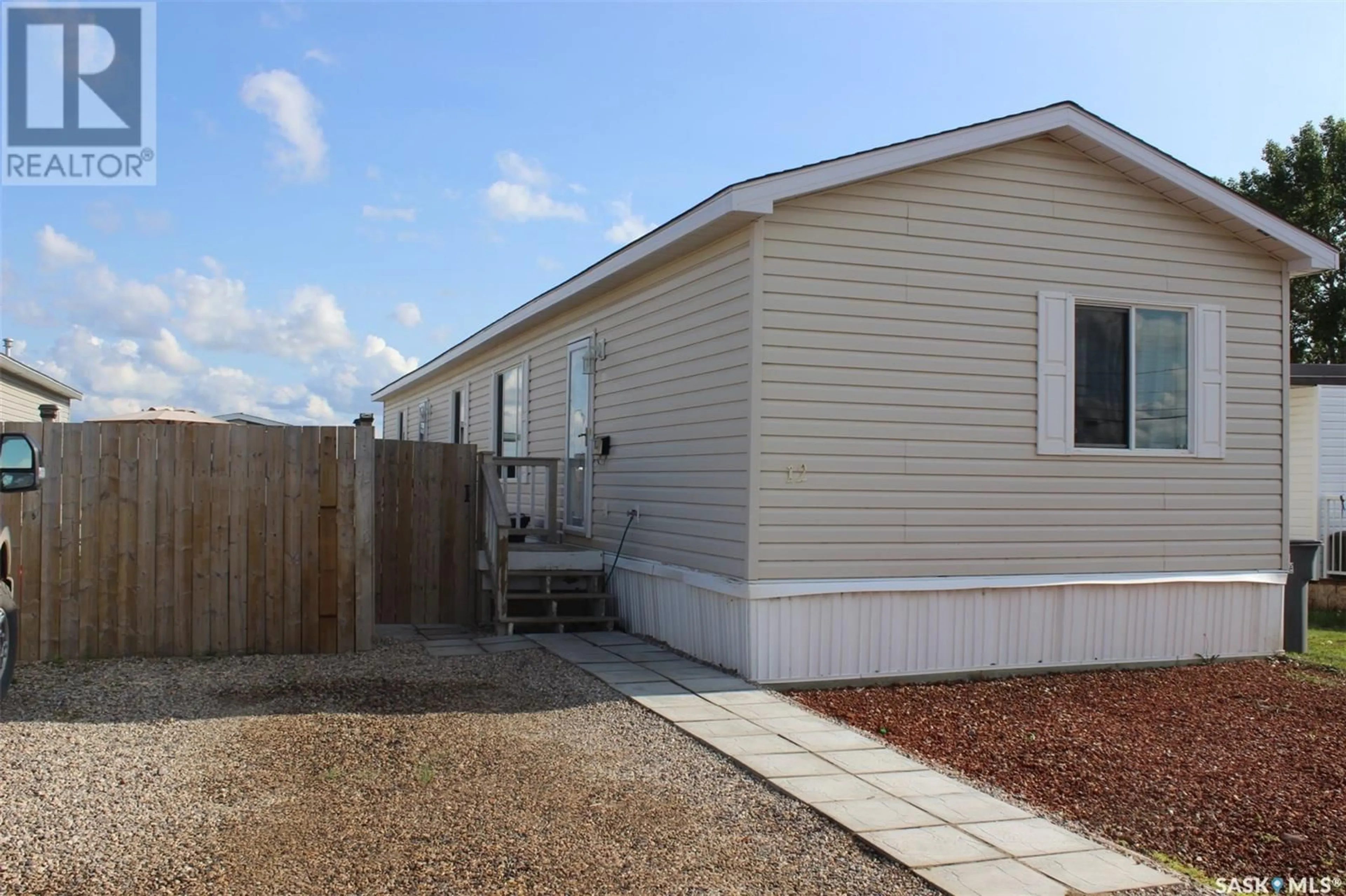 Home with vinyl exterior material for 12 106 1st AVENUE SW, Weyburn Saskatchewan S4H2J1