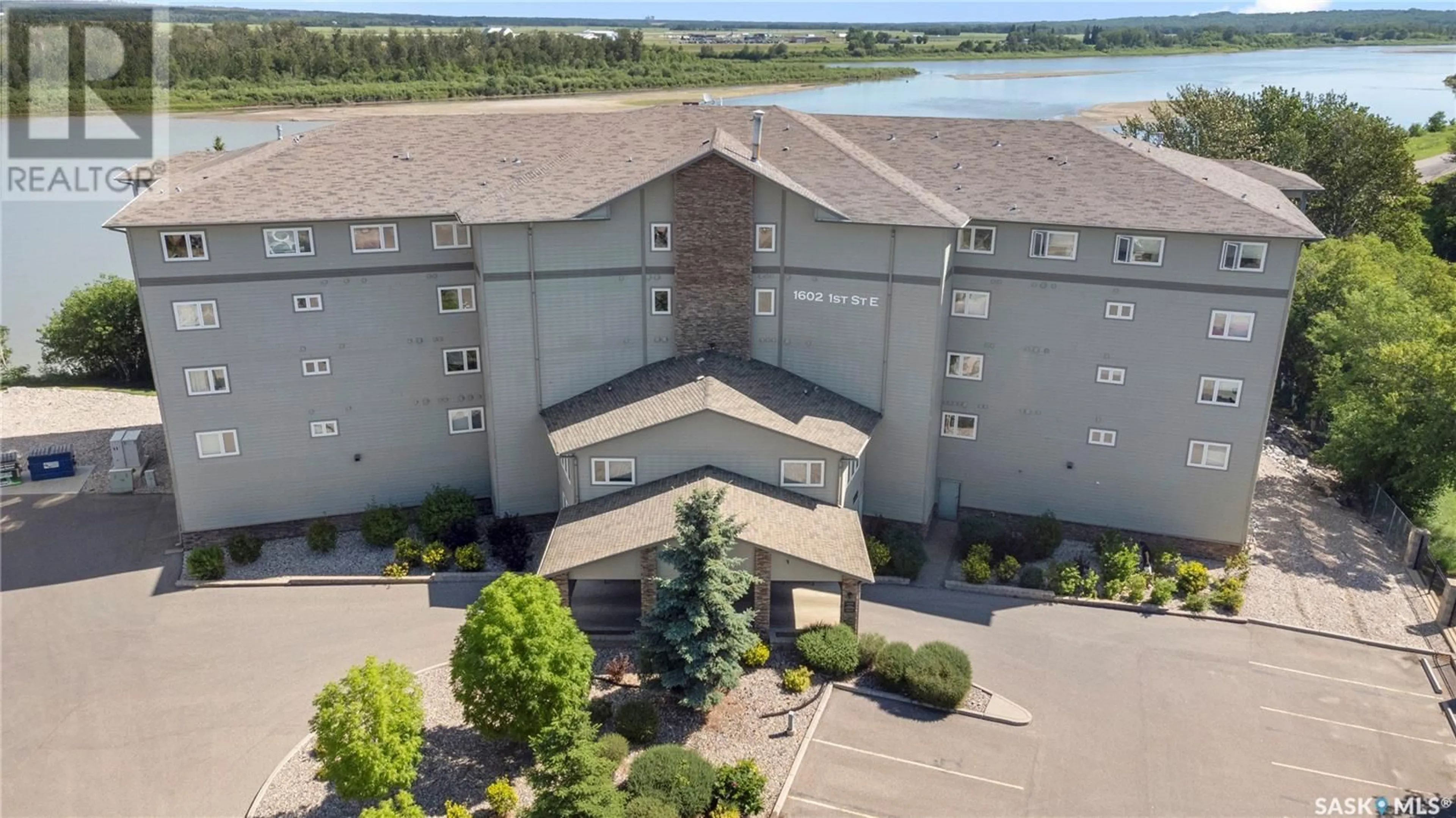 A pic from outside/outdoor area/front of a property/back of a property/a pic from drone, water/lake/river/ocean view for 103 - 1602 1ST STREET, Prince Albert Saskatchewan S6V1G7