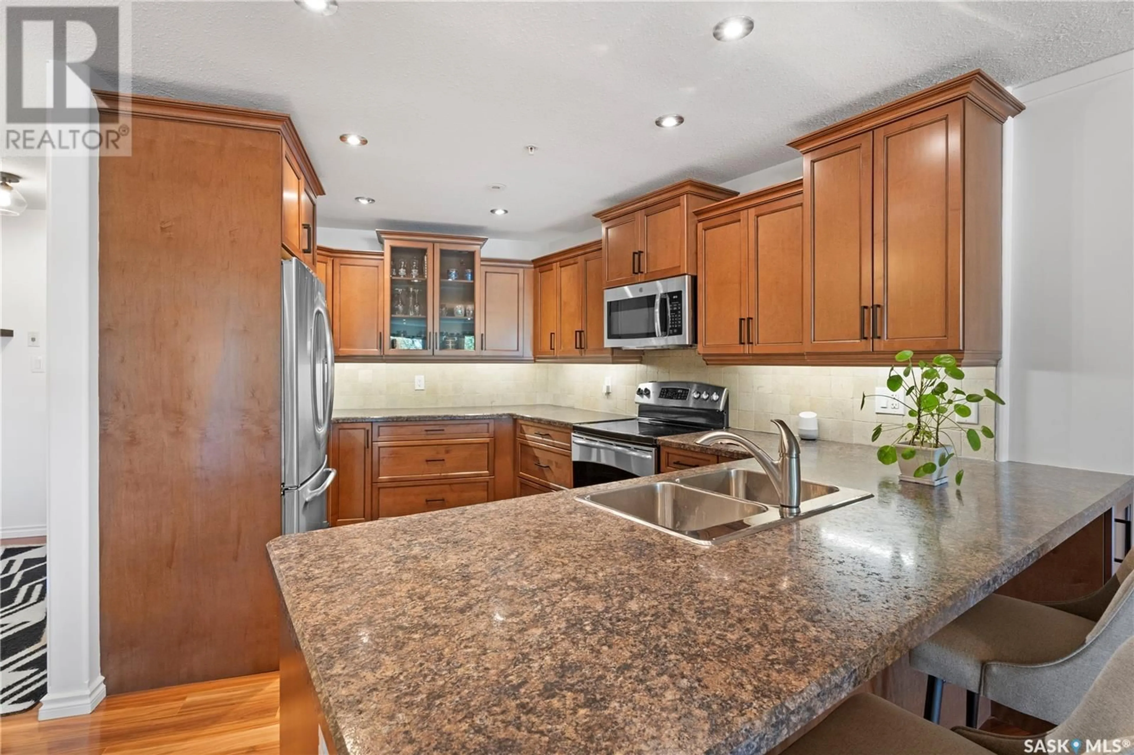 Open concept kitchen, ceramic/tile floor for 103 - 1602 1ST STREET, Prince Albert Saskatchewan S6V1G7