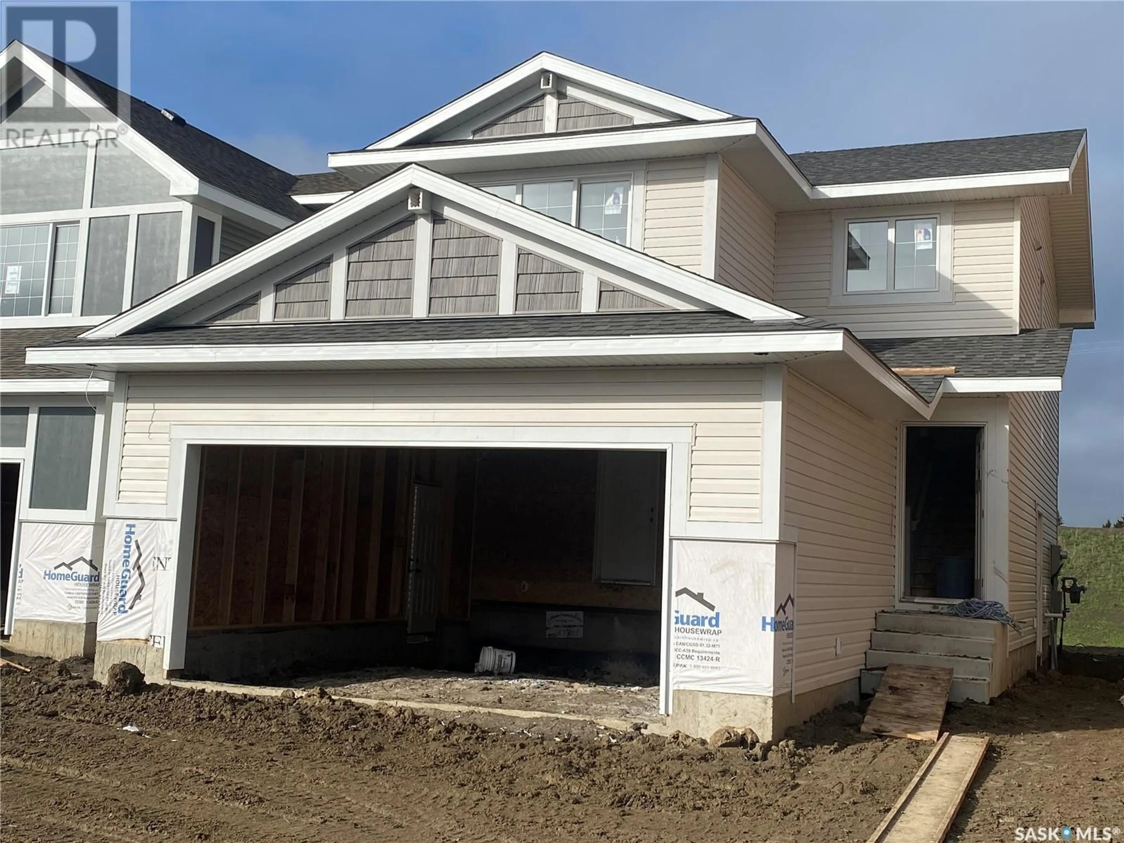 Home with vinyl exterior material for 318 Pepper PLACE, Saskatoon Saskatchewan S7V1S7