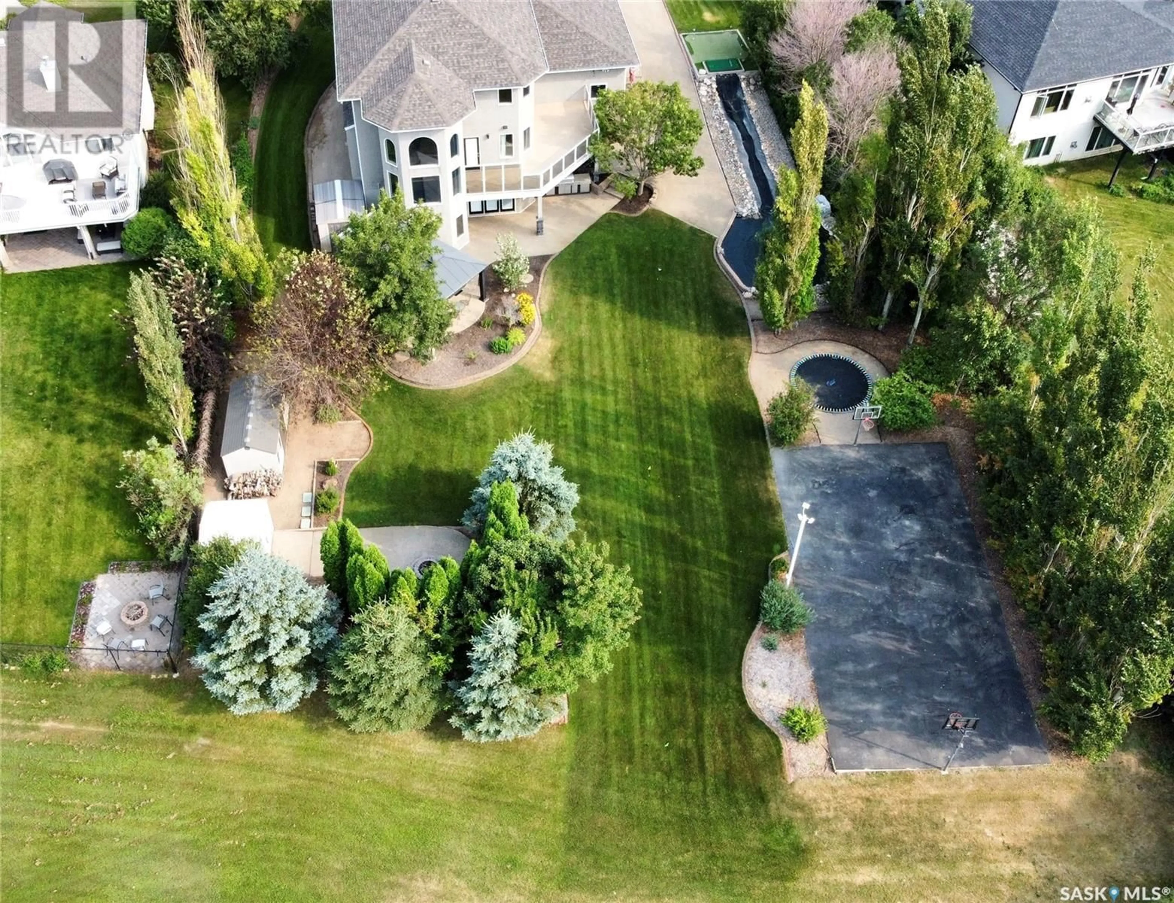 Frontside or backside of a home, the fenced backyard for 14 Emerald RIDGE, White City Saskatchewan S4L5B1