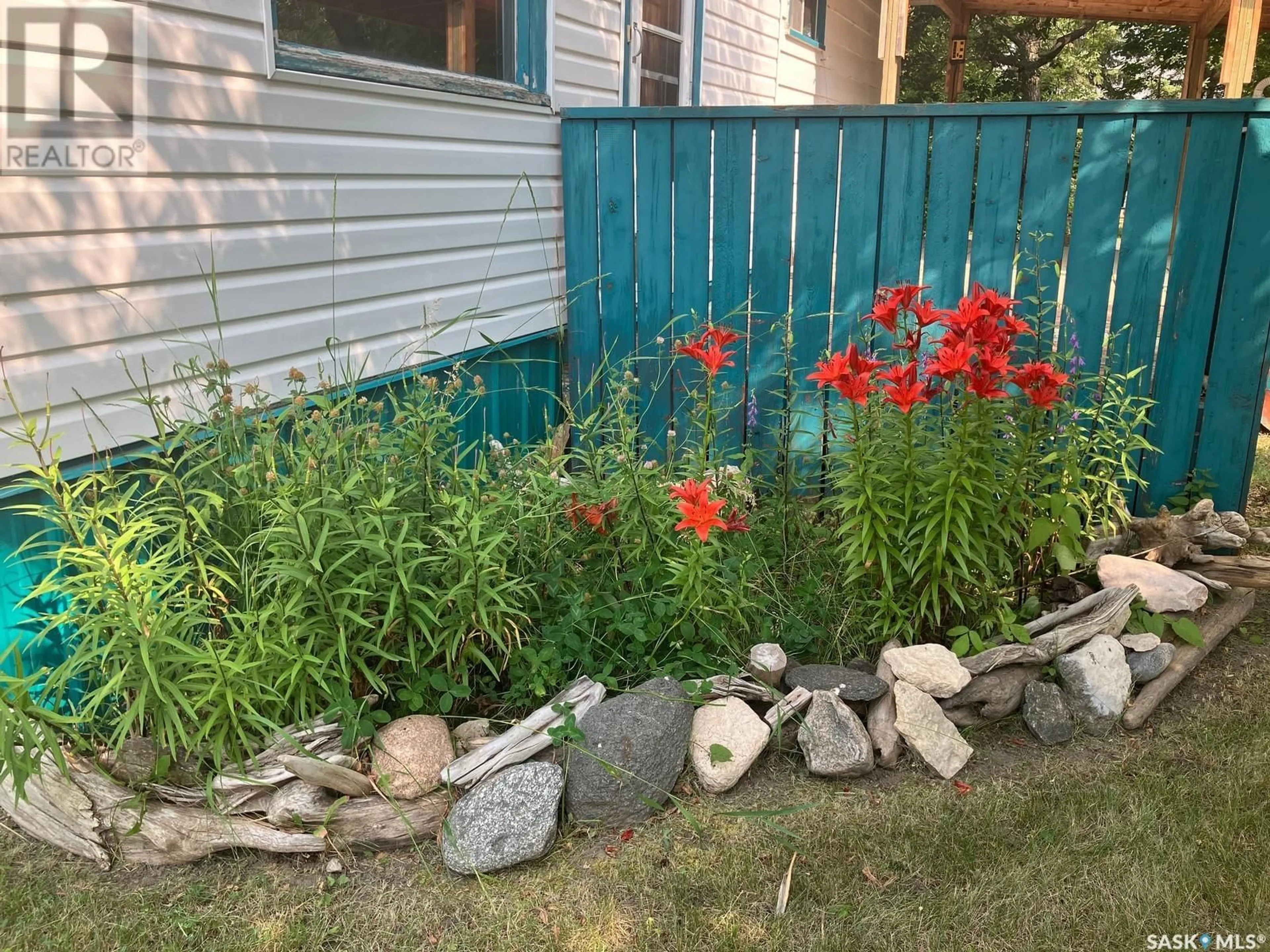 A pic from exterior of the house or condo, the fenced backyard for 300 5th STREET N, Nipawin Saskatchewan S0E1E0