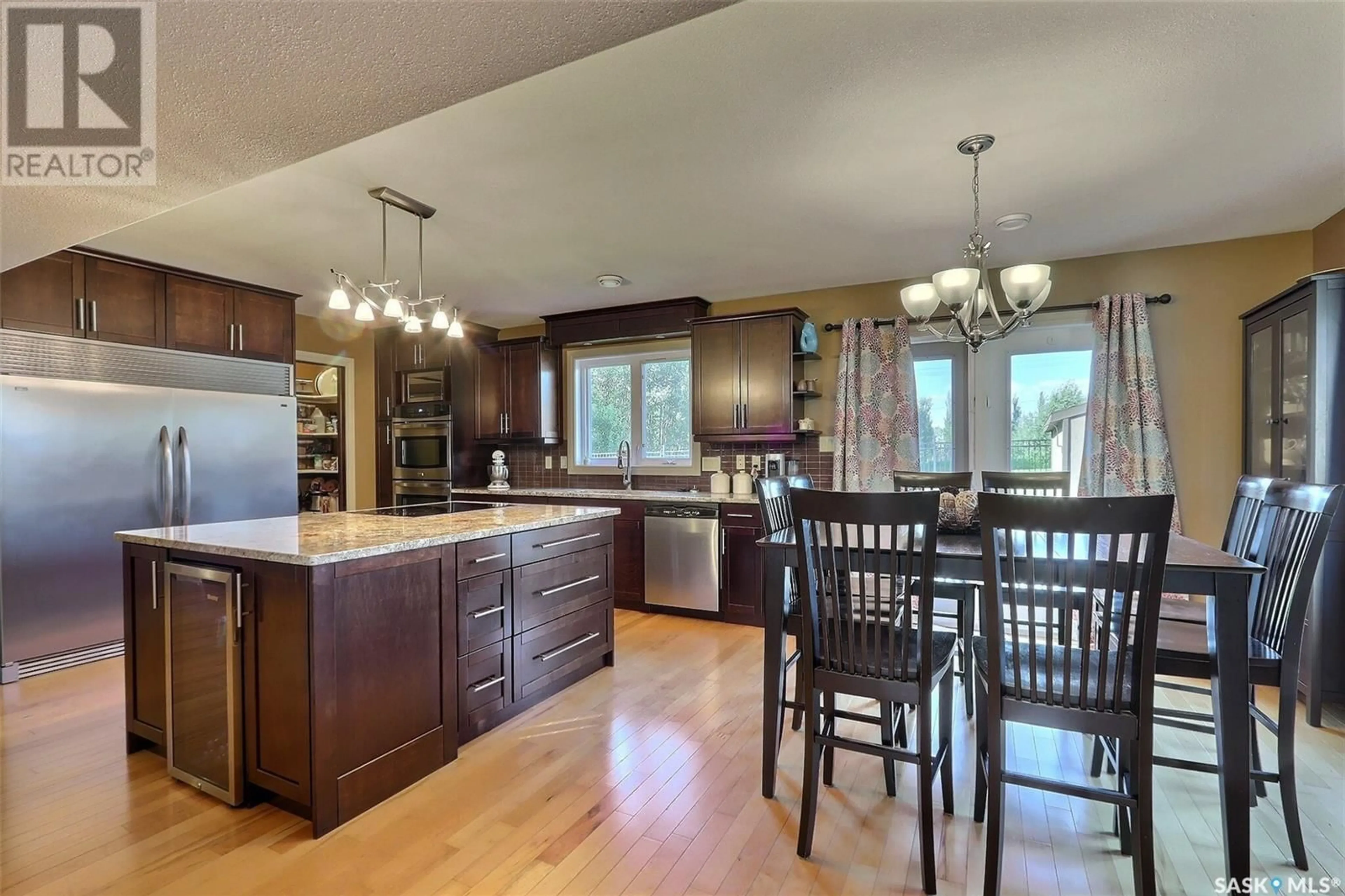 Open concept kitchen, wood/laminate floor for 40 GUY DRIVE, Prince Albert Saskatchewan S6X0A3