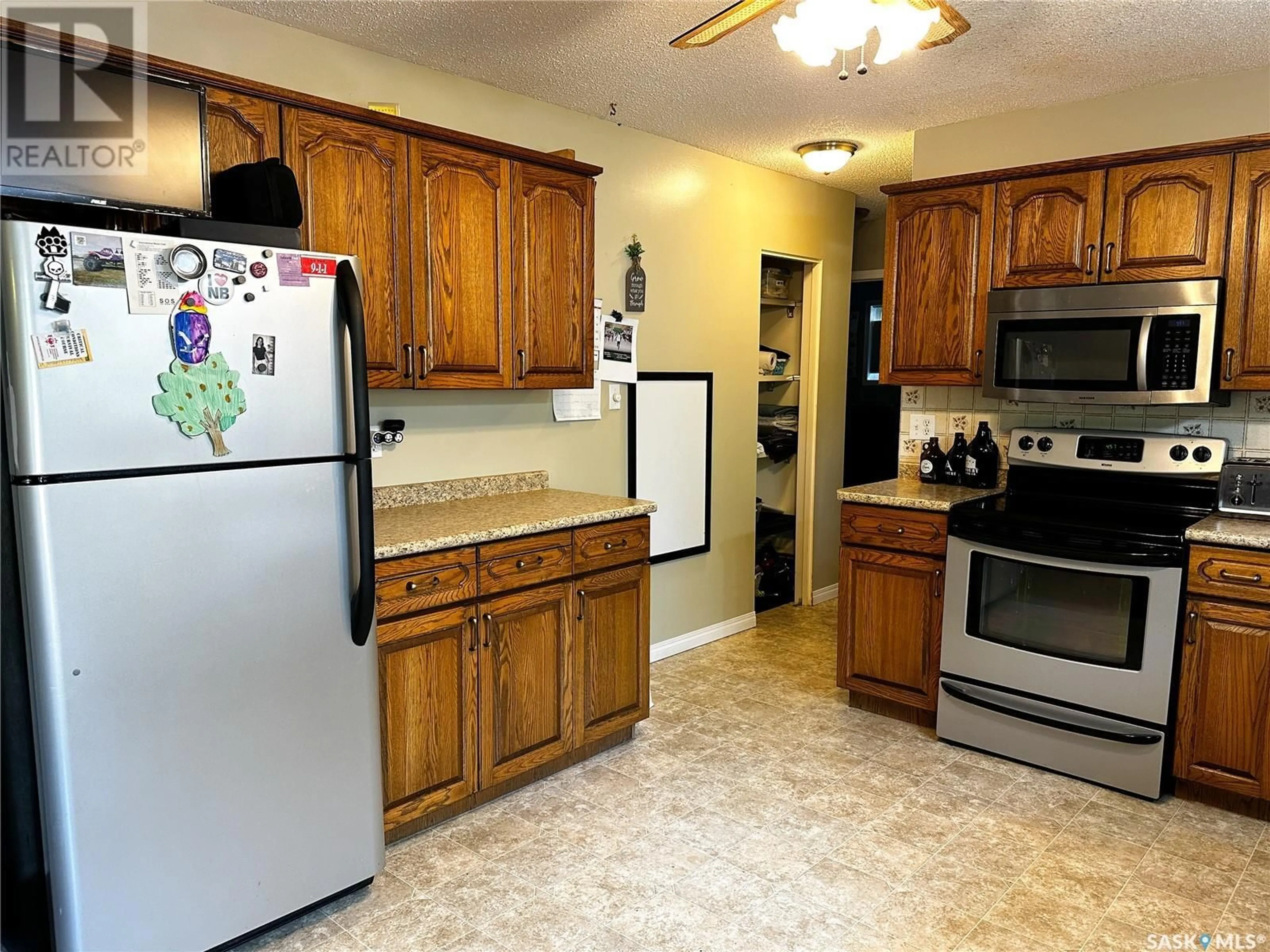 Standard kitchen, wood floors, cottage for 8911 Gregory DRIVE, North Battleford Saskatchewan S9A2W6