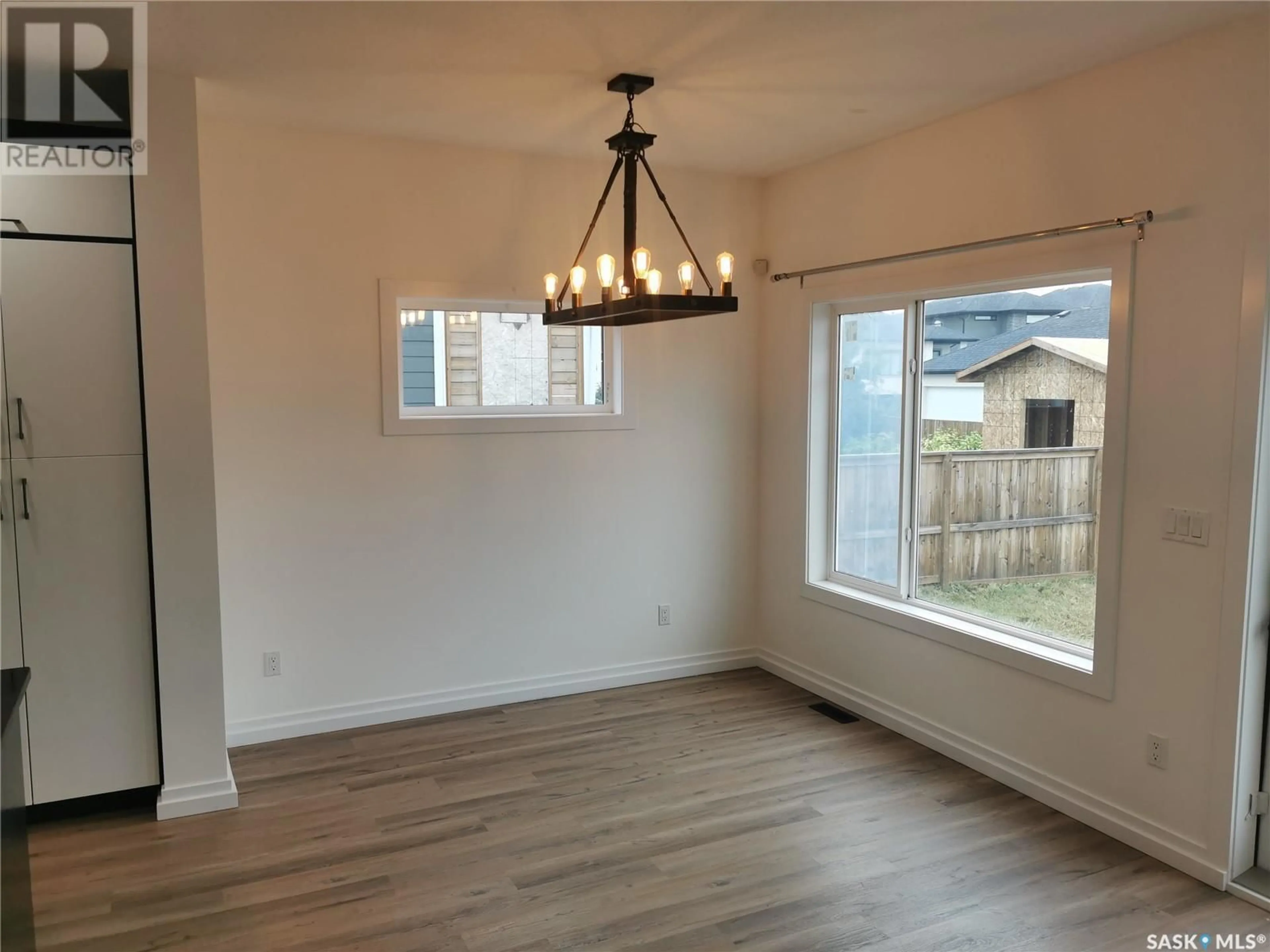 A pic of a room, wood floors for 686 Fast CRESCENT, Saskatoon Saskatchewan S7W0X1