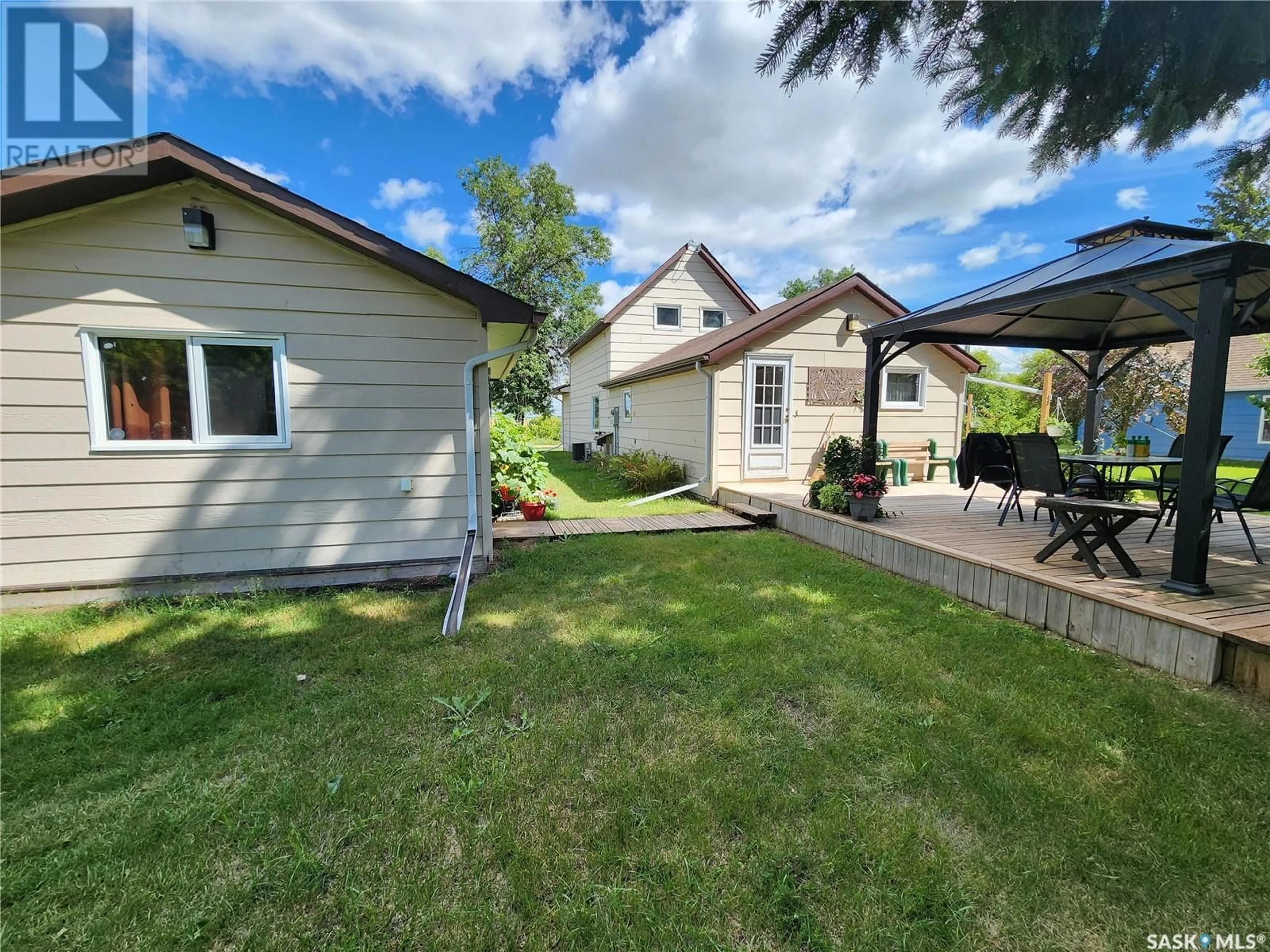 Frontside or backside of a home, the fenced backyard for 207 Garnet STREET S, Wolseley Saskatchewan S0G5H0