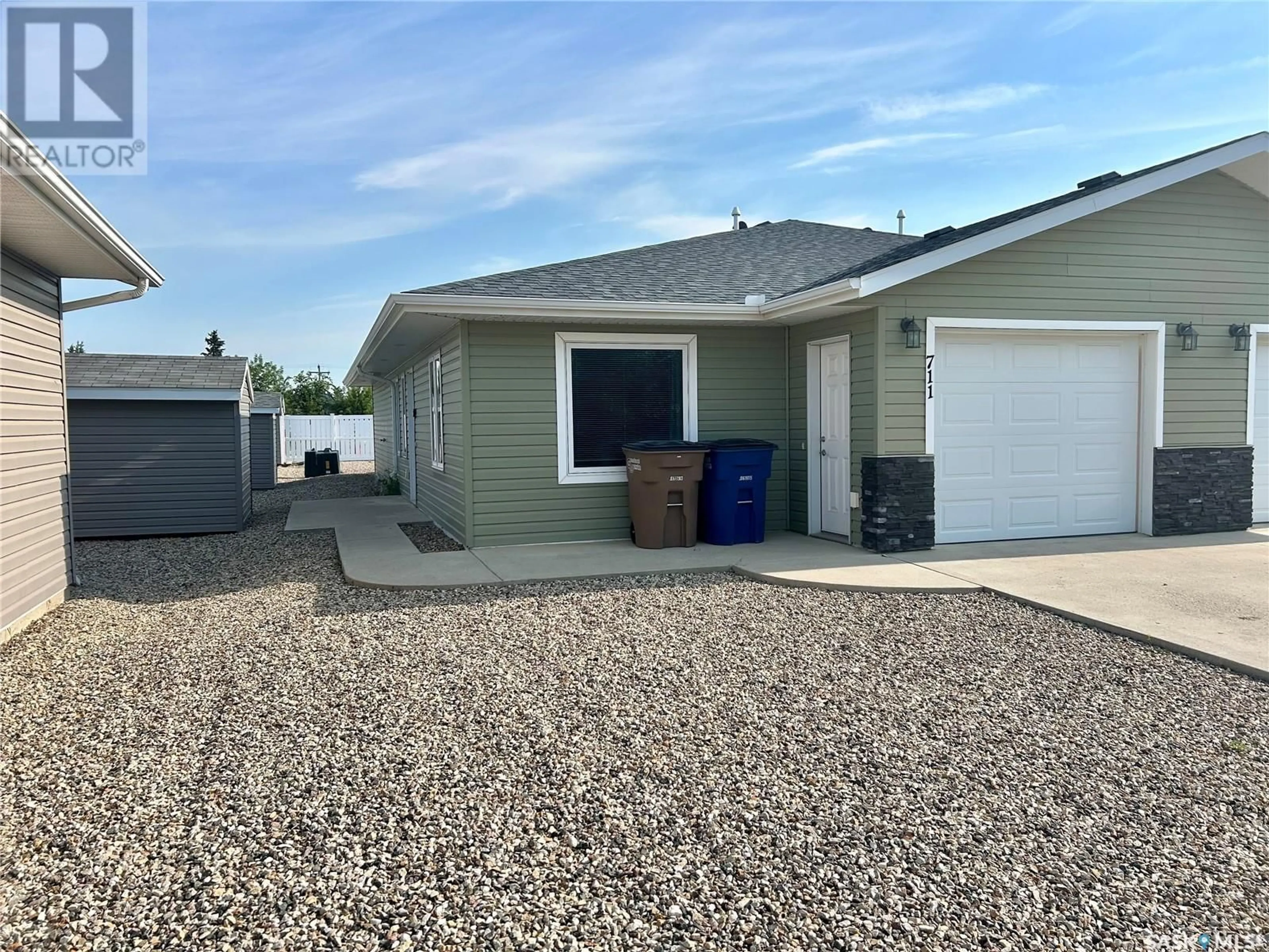 Frontside or backside of a home for 711 101st AVENUE, Tisdale Saskatchewan S0E1T0