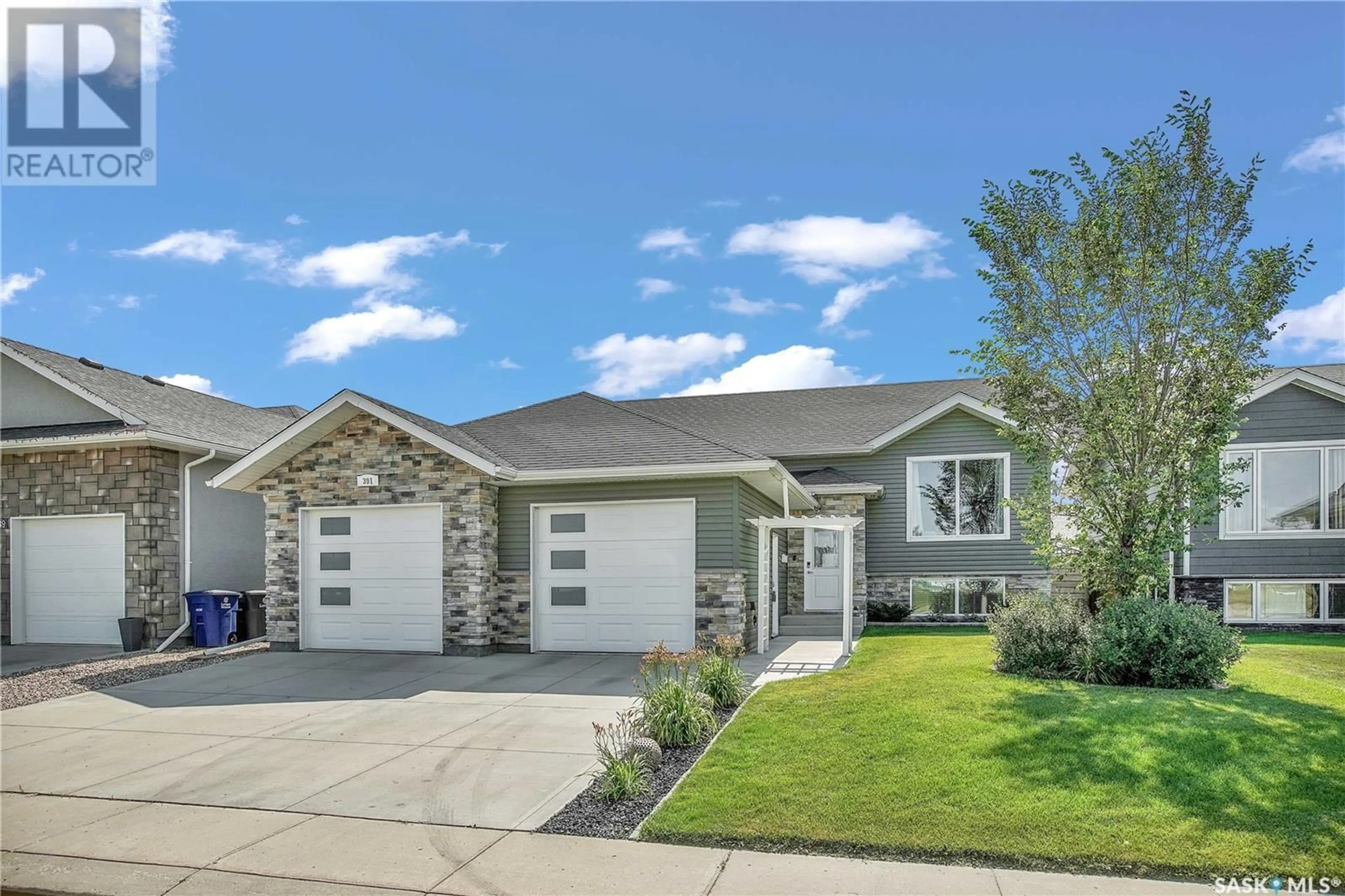 Frontside or backside of a home for 391 Clubhouse BOULEVARD, Warman Saskatchewan S0K4S2