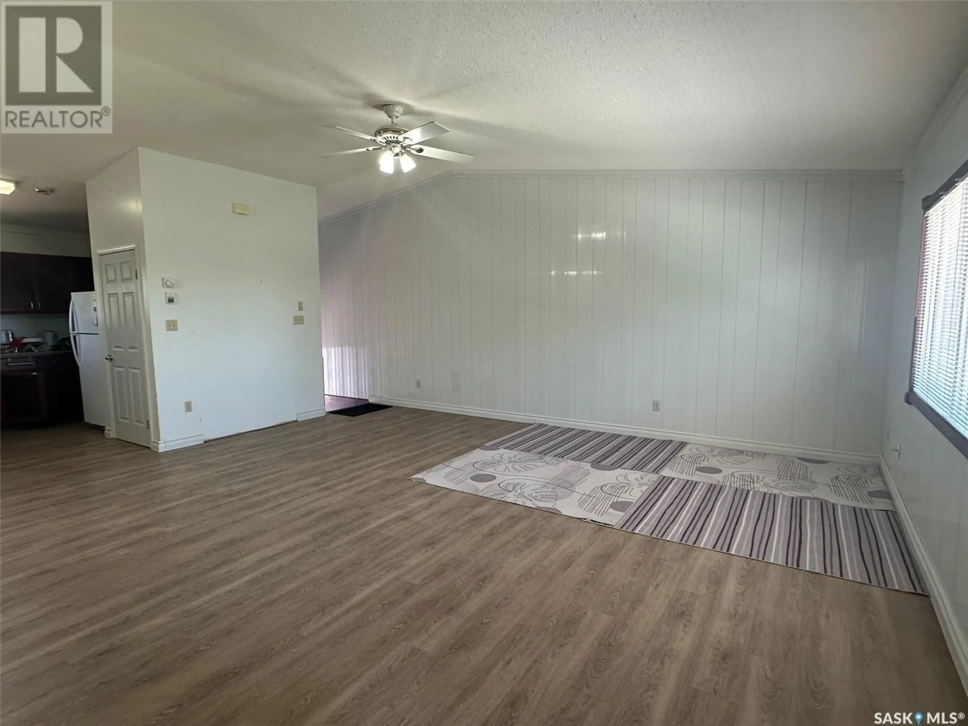 A pic of a room, wood floors for 3 120 Cessna STREET W, Air Ronge Saskatchewan S0J3G0