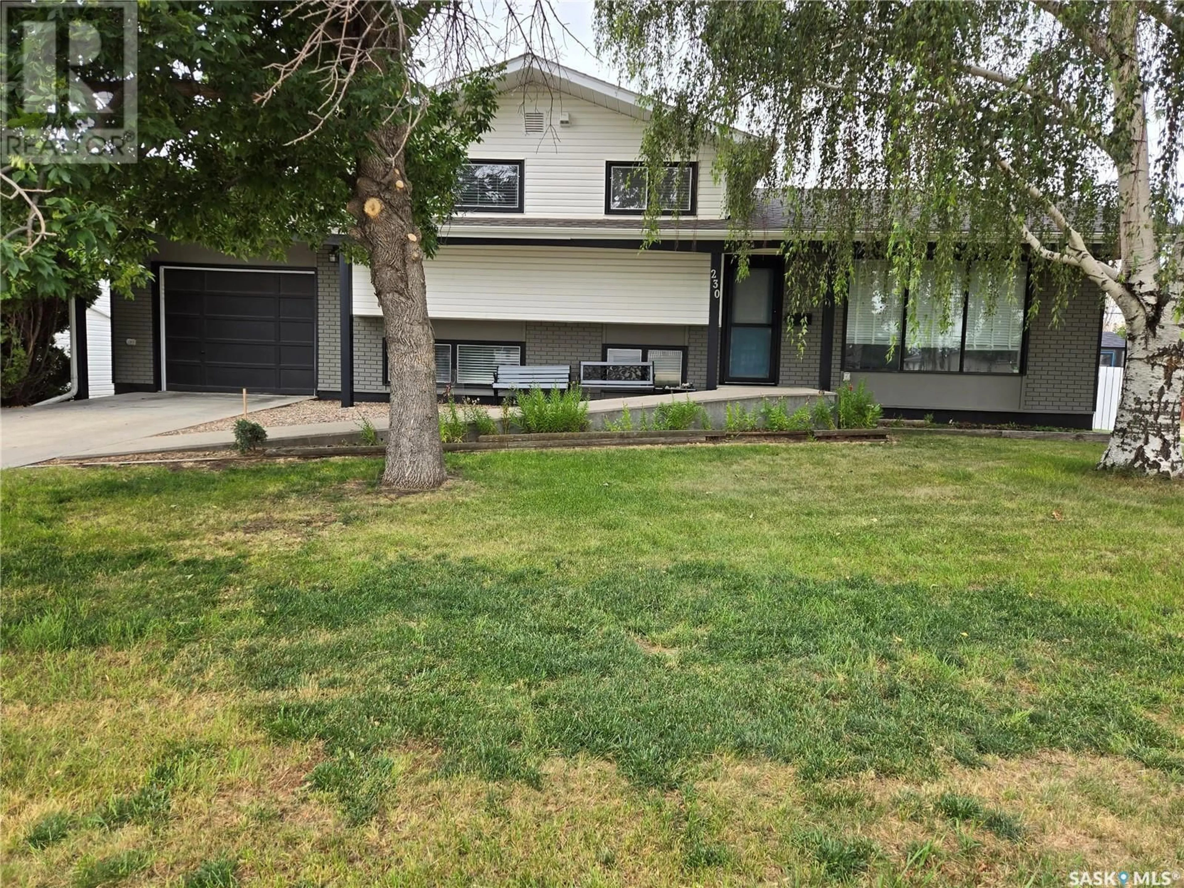 Frontside or backside of a home for 230 Ash STREET, Outlook Saskatchewan S0L2N0