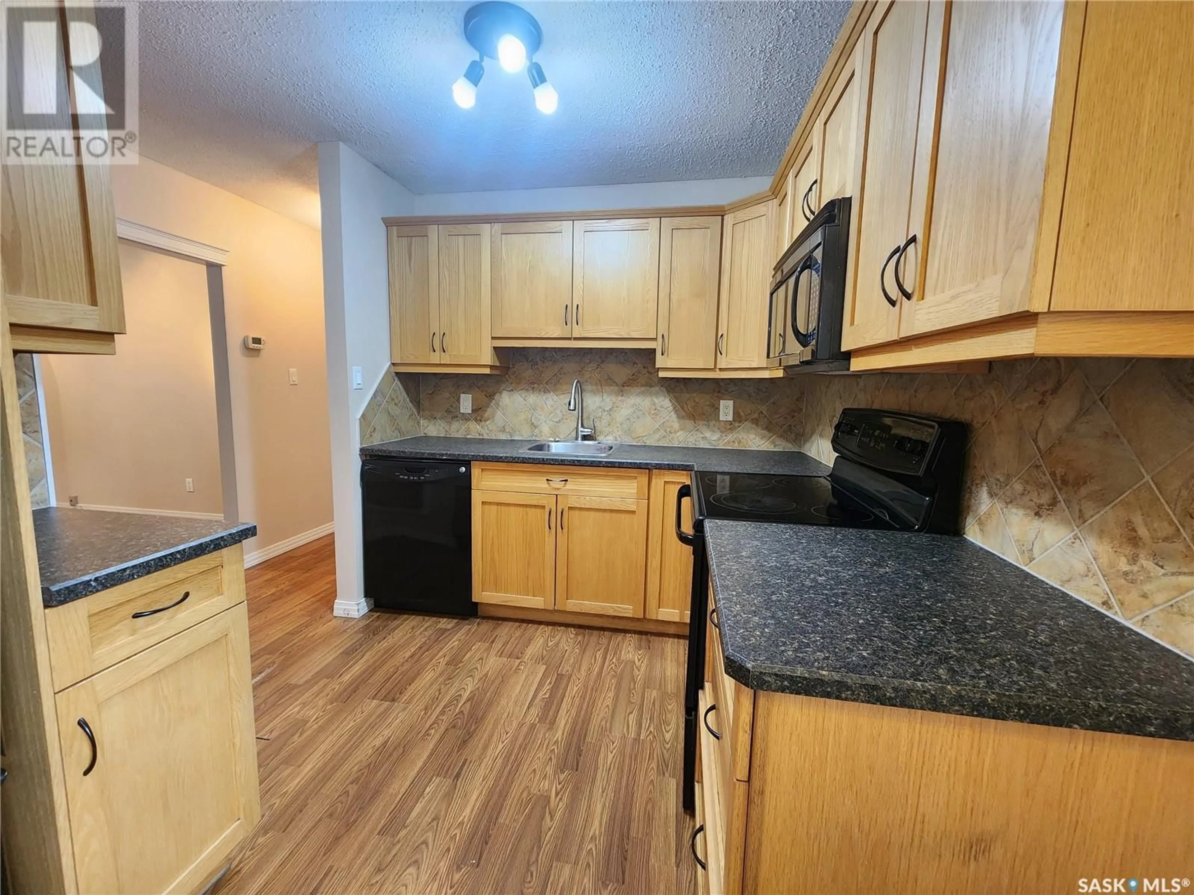 Standard kitchen, wood floors, cottage for 1118 PARK AVENUE, Weyburn Saskatchewan S4H0K5