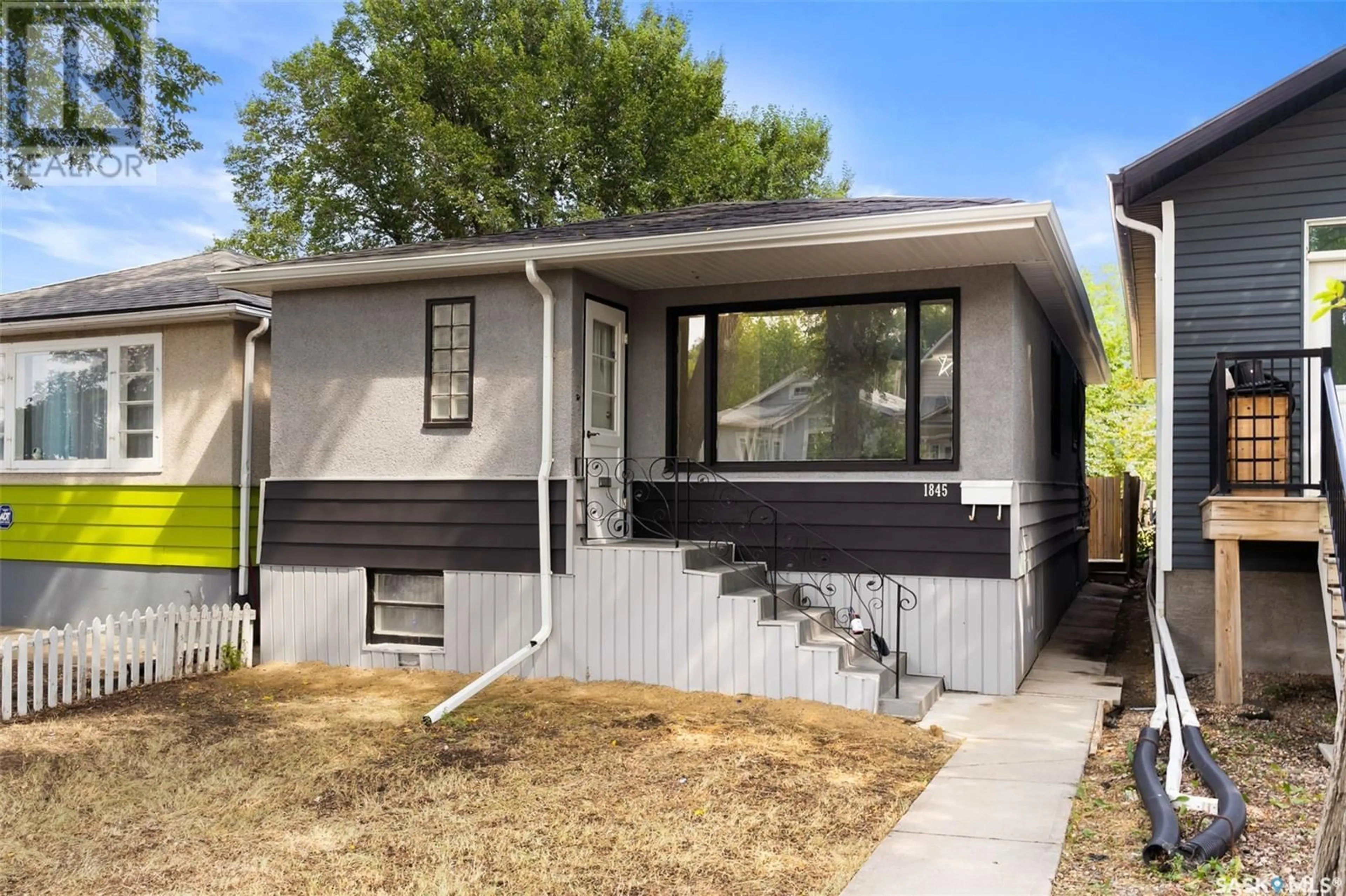 Home with vinyl exterior material for 1845 Montreal STREET, Regina Saskatchewan S4P1L2