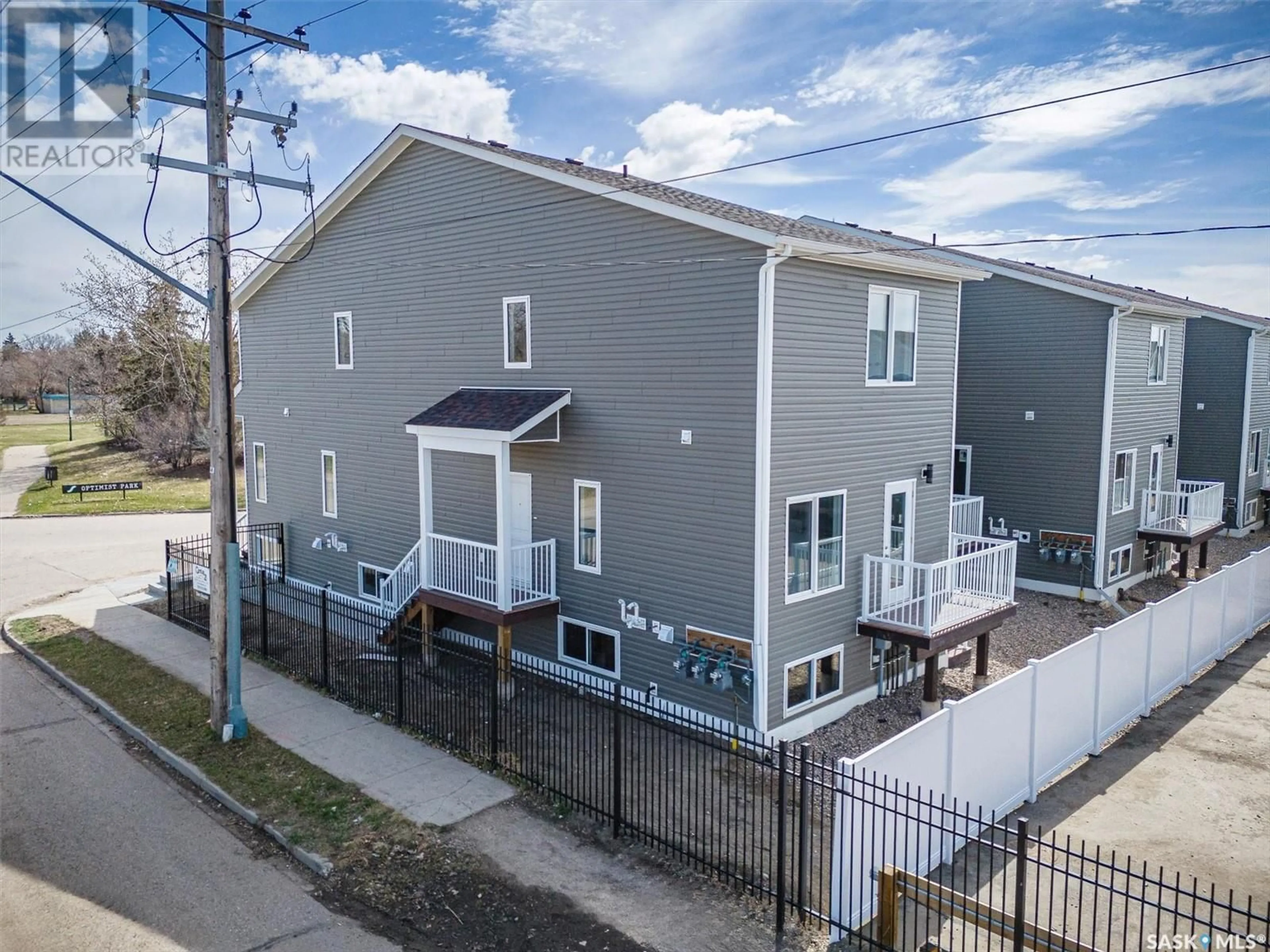 A pic from exterior of the house or condo, the fenced backyard for 423 L AVENUE S, Saskatoon Saskatchewan S7M5Y6