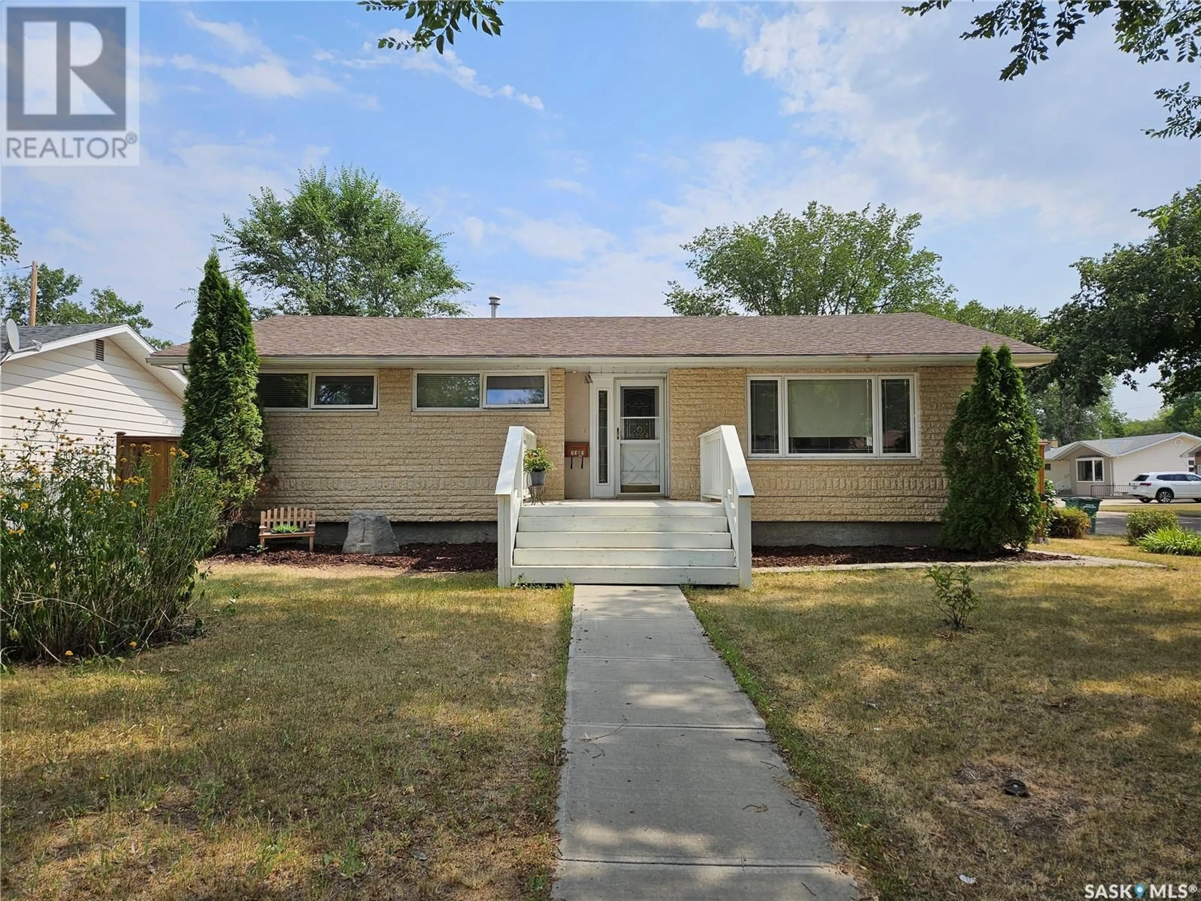 Frontside or backside of a home for 1101 13th AVENUE NW, Moose Jaw Saskatchewan S6H4N5