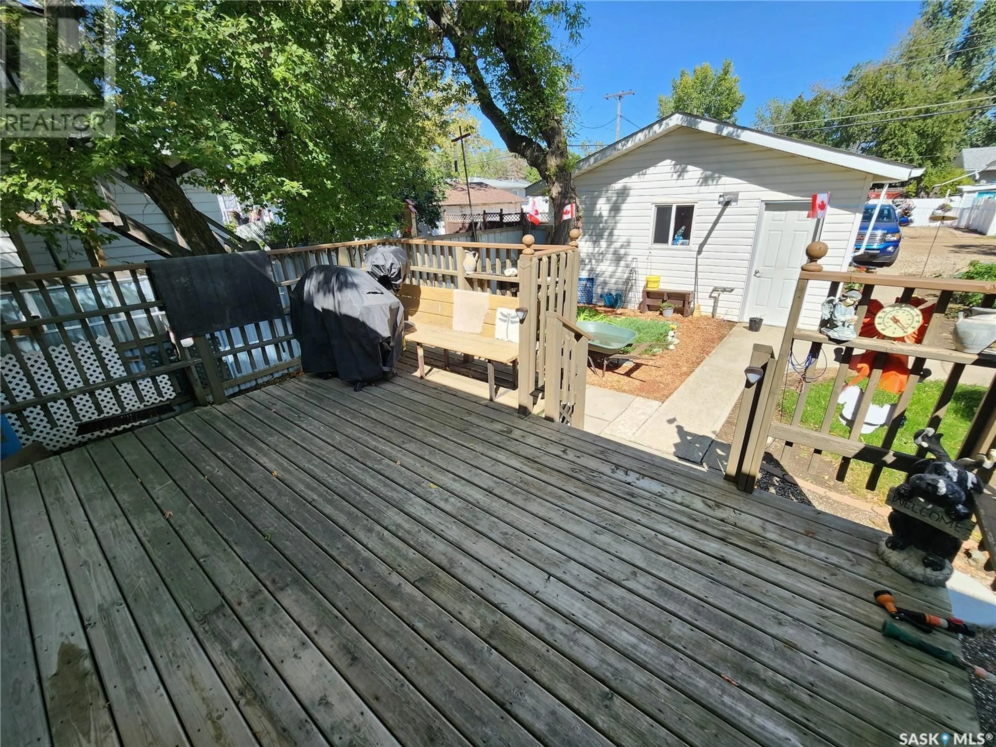 Patio, the fenced backyard for 205 1st AVENUE NW, Weyburn Saskatchewan S4H1N8