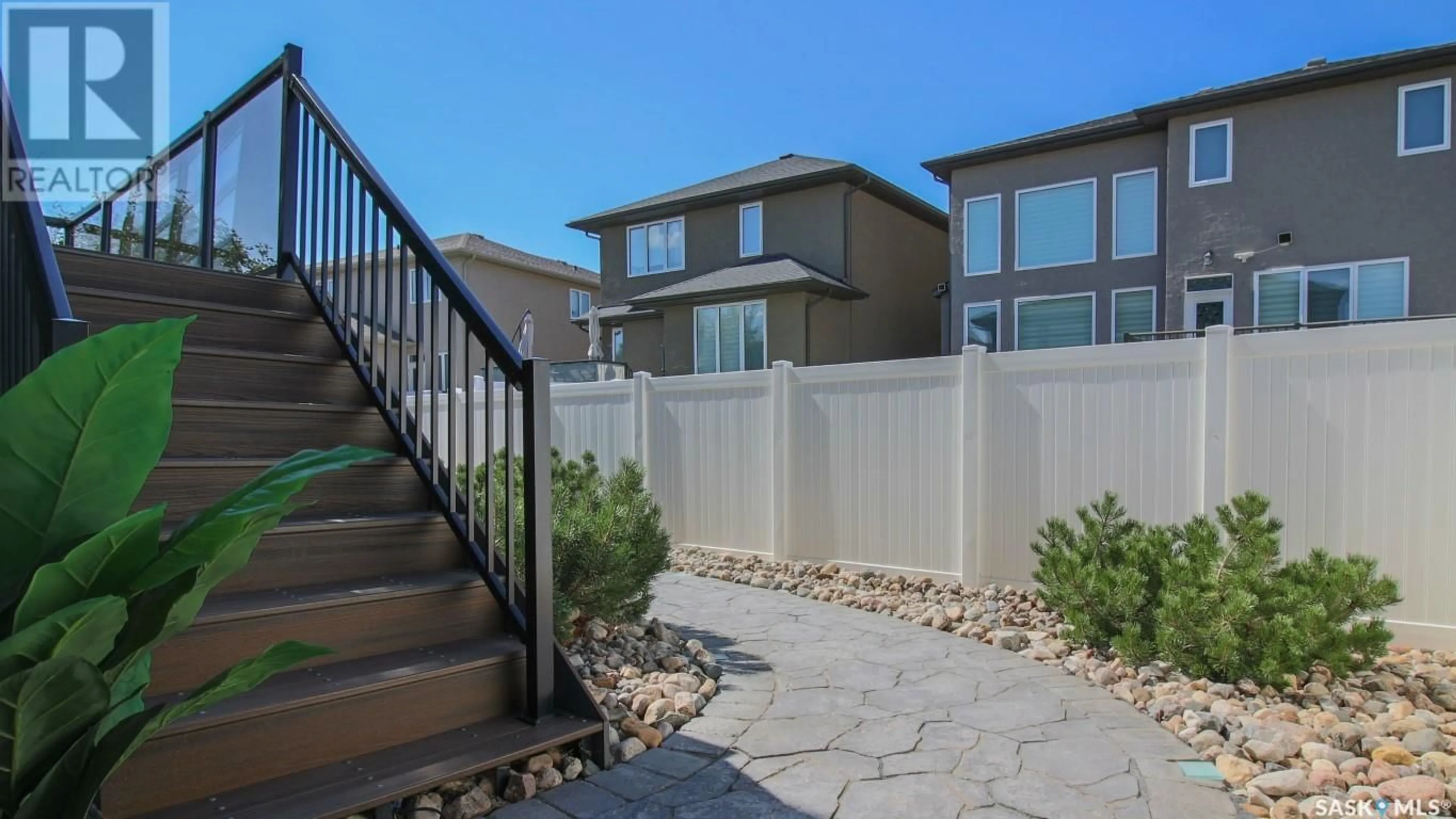 Frontside or backside of a home, the fenced backyard for 3878 Goldfinch WAY, Regina Saskatchewan S4V1S3