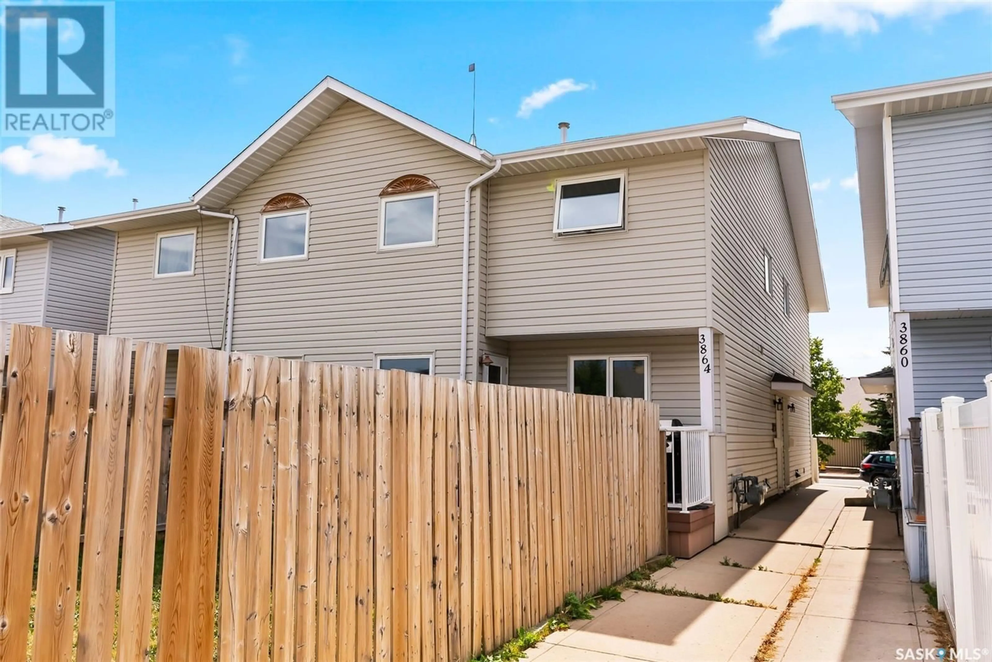 A pic from exterior of the house or condo, the fenced backyard for 3864 7th AVENUE E, Regina Saskatchewan S4N7L9