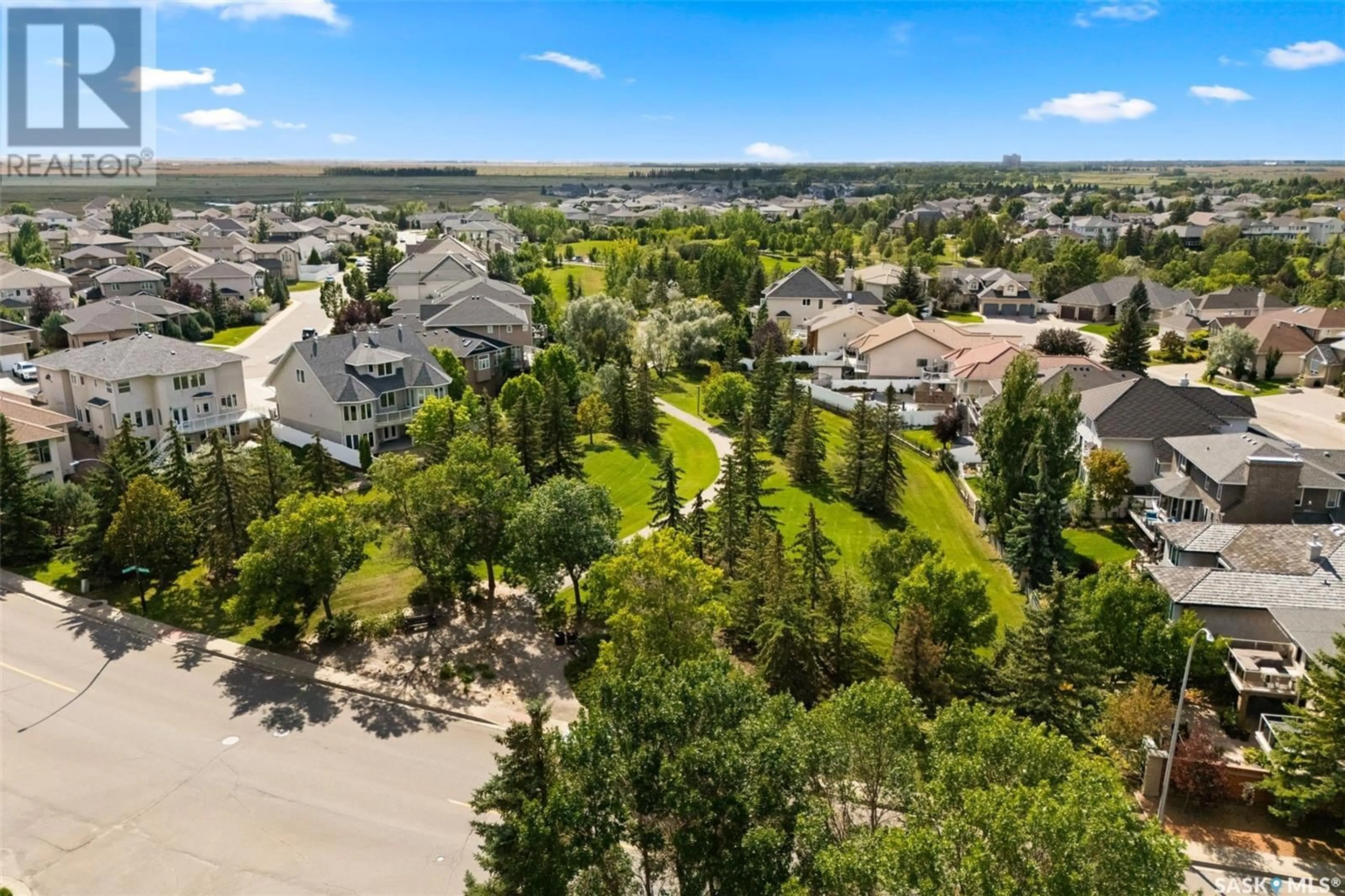 A pic from exterior of the house or condo, the fenced backyard for 6006 Wascana COURT, Regina Saskatchewan S4V3B5