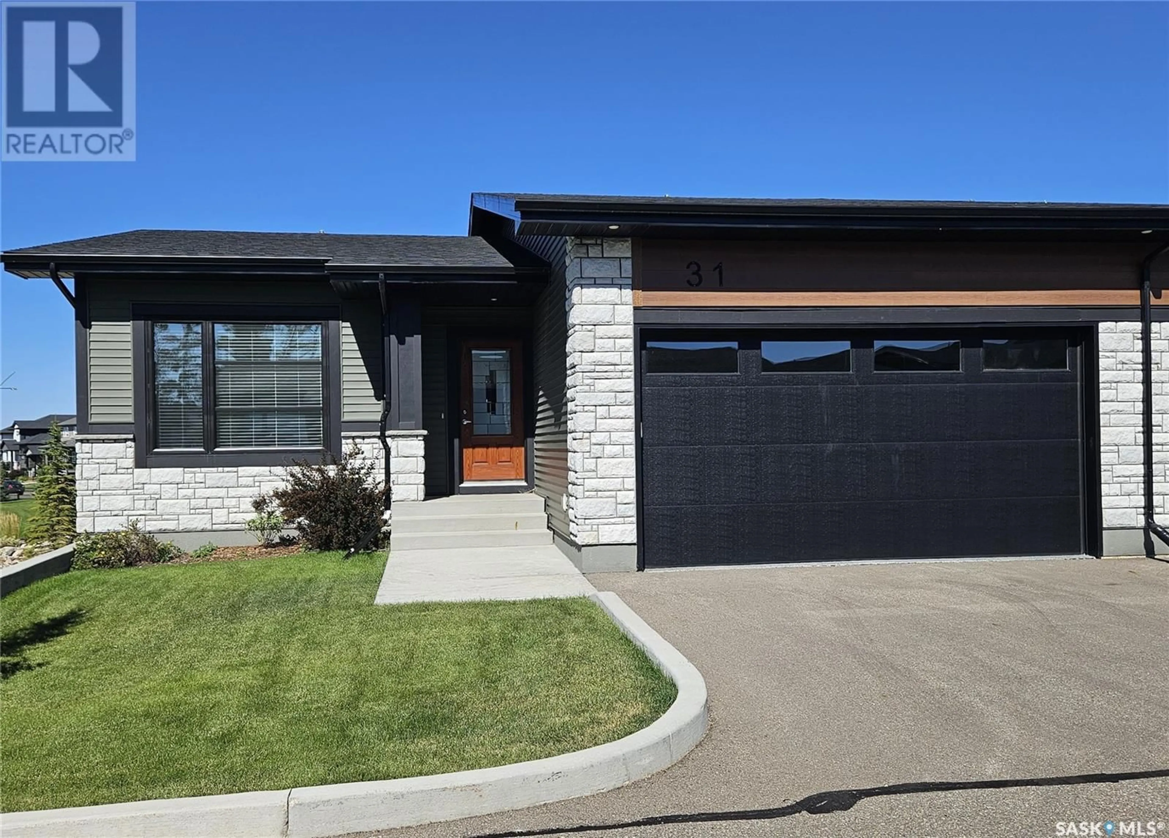 Home with brick exterior material for 31 310 Evergreen BOULEVARD, Saskatoon Saskatchewan S7W0Z1