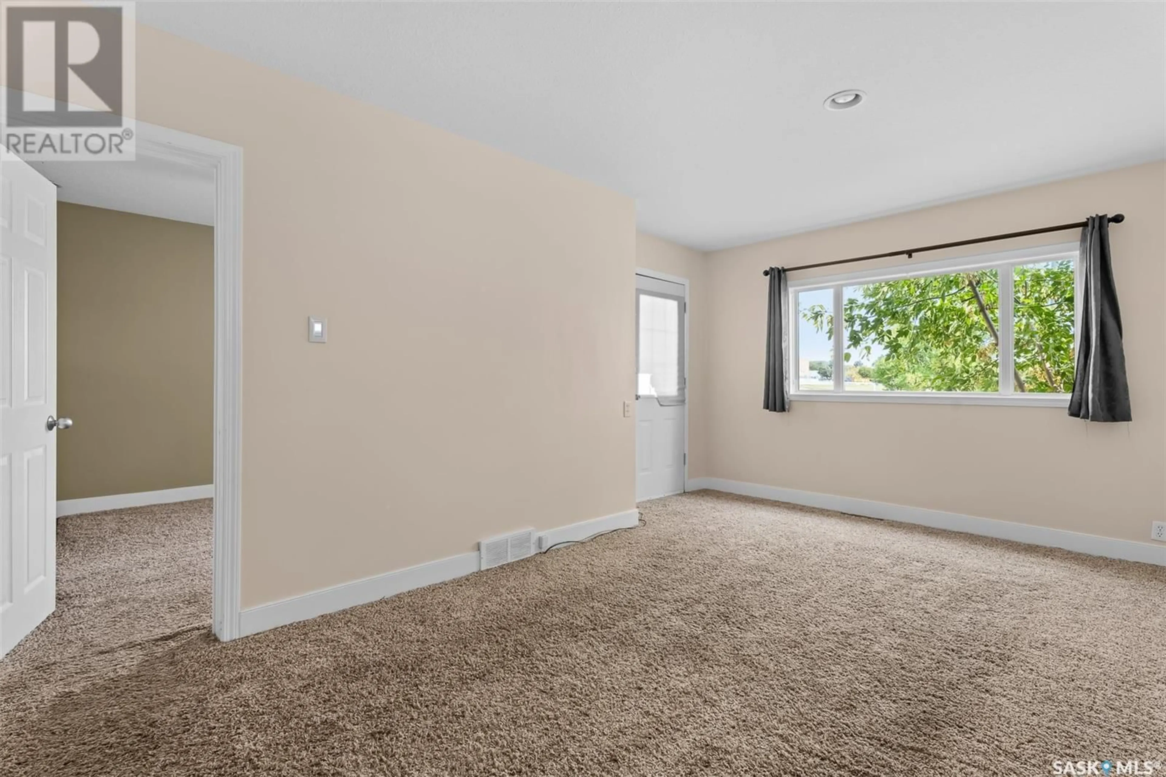 A pic of a room, carpet floors for 612 9th AVENUE NW, Moose Jaw Saskatchewan S6H4H8