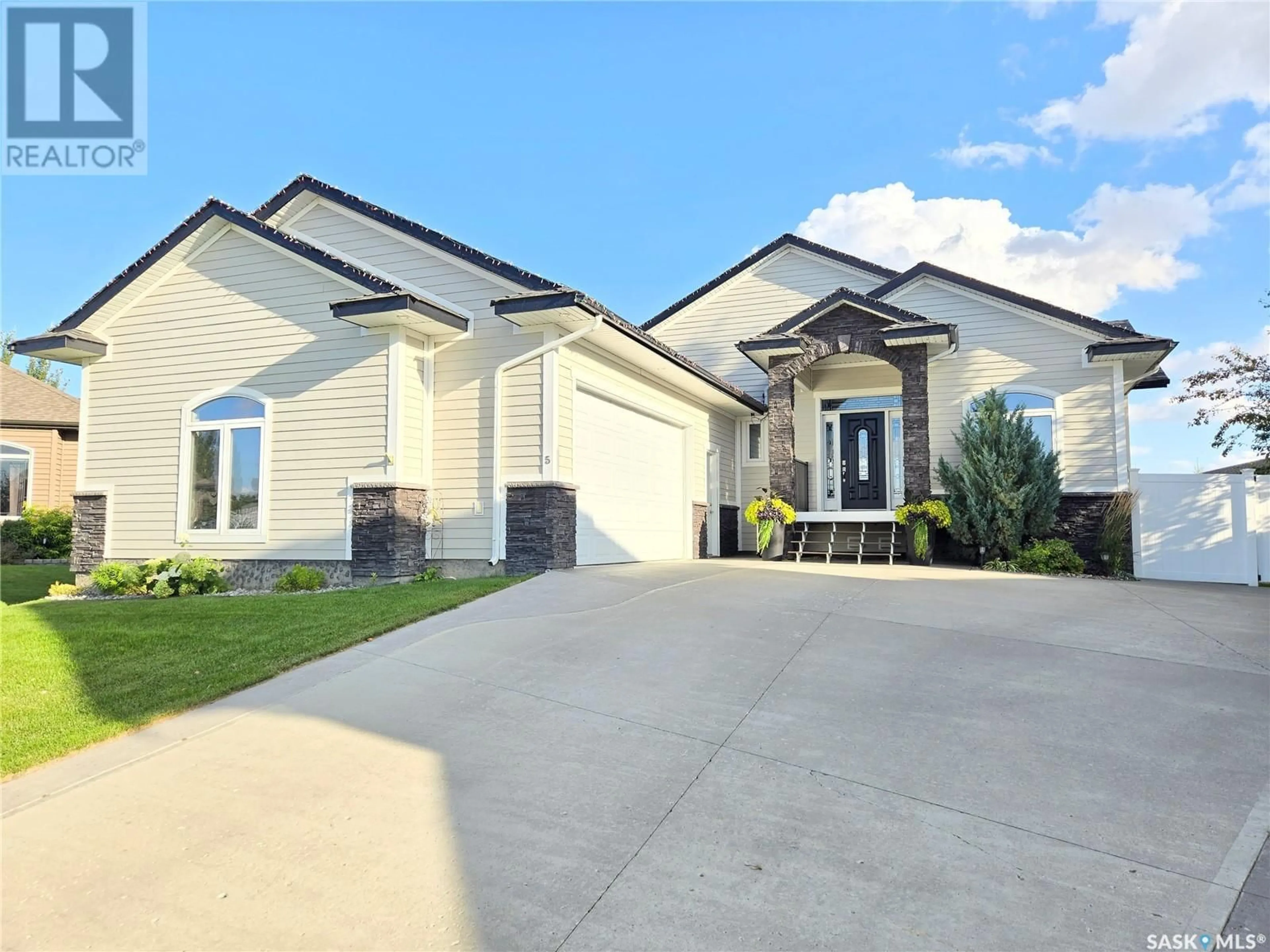 Frontside or backside of a home for 5 Cedar PLACE, Outlook Saskatchewan S0L2N0