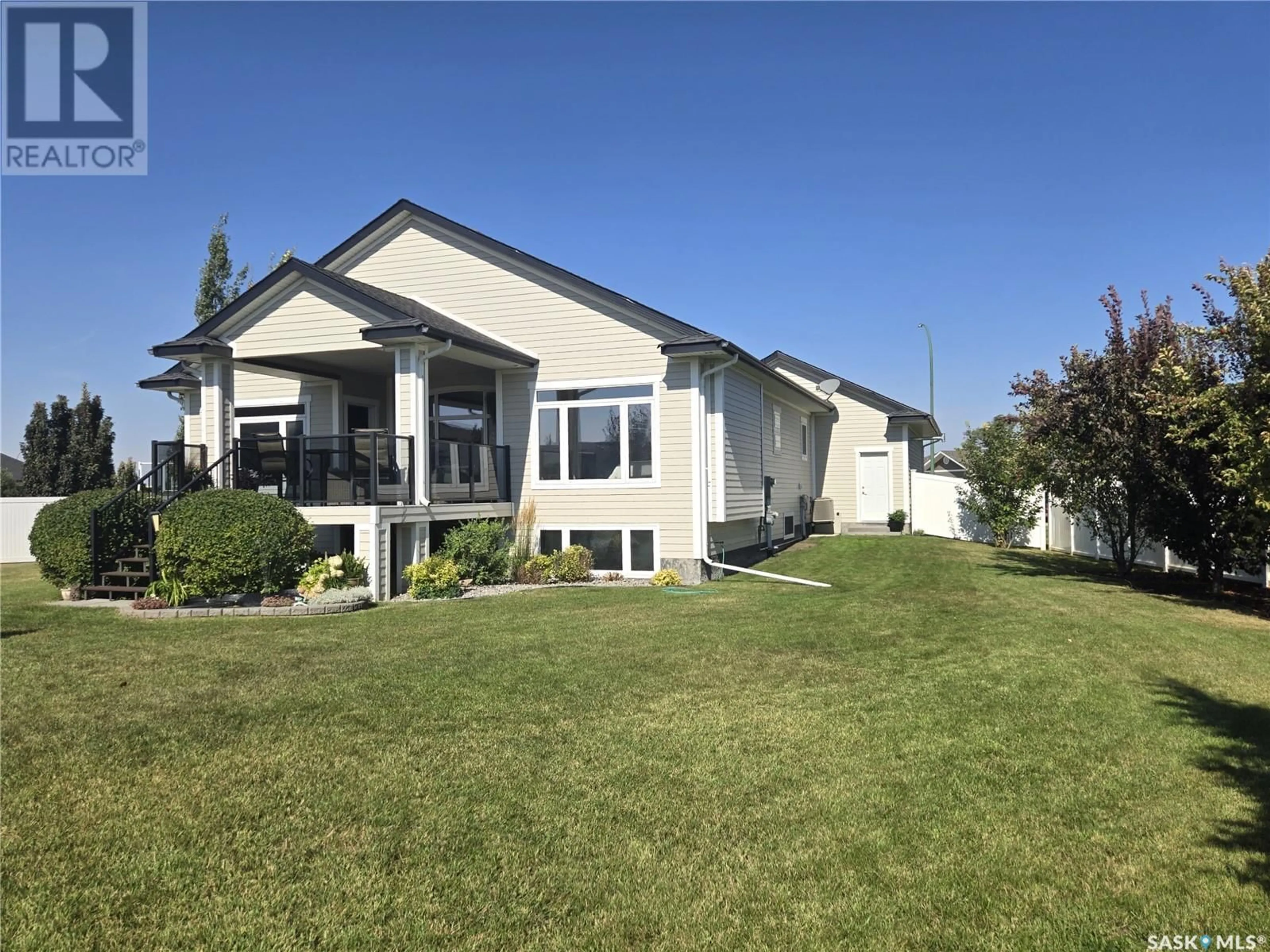 Frontside or backside of a home for 5 Cedar PLACE, Outlook Saskatchewan S0L2N0