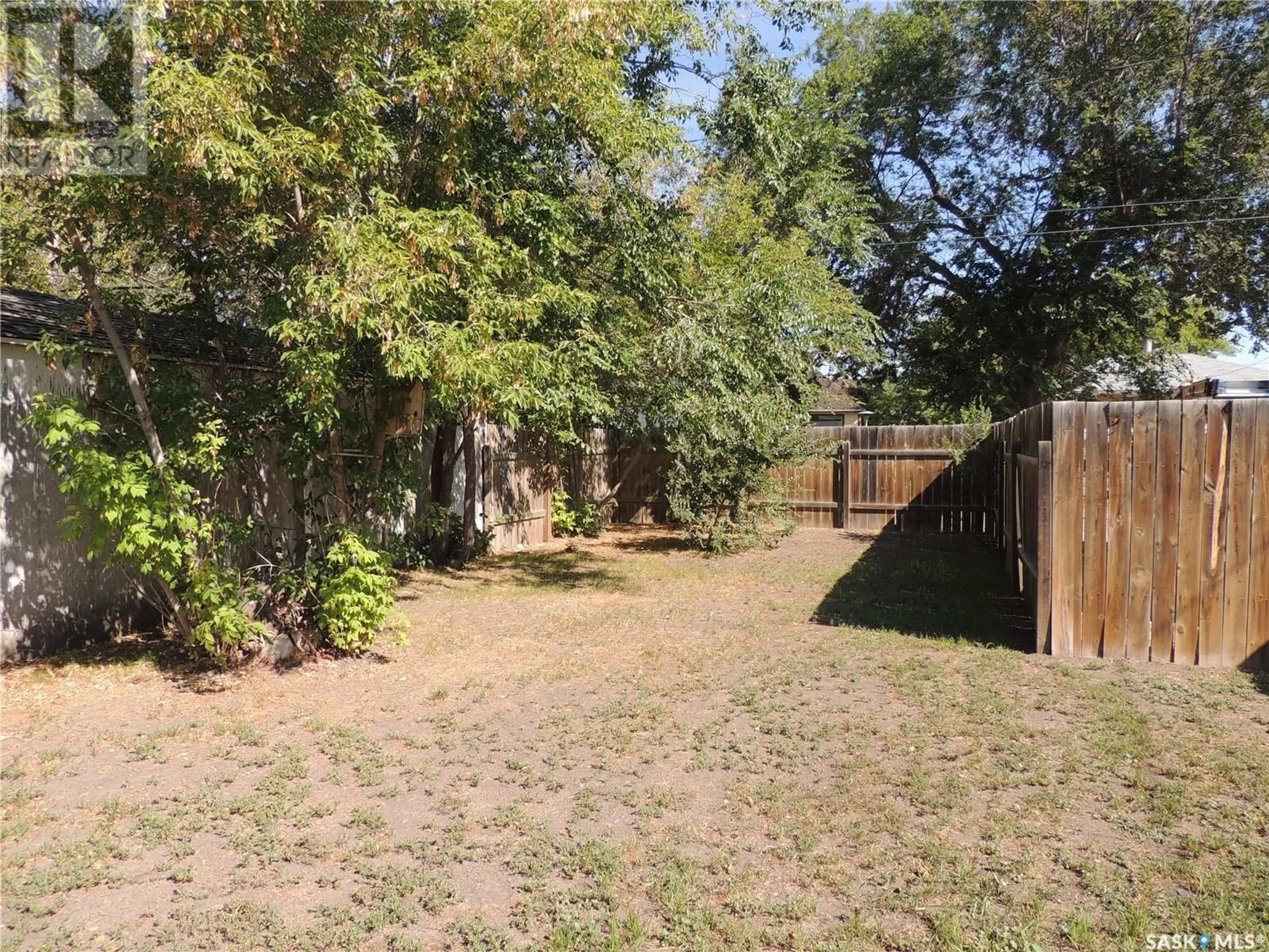 Patio, the fenced backyard for 1421 4th STREET, Estevan Saskatchewan S4A0X3