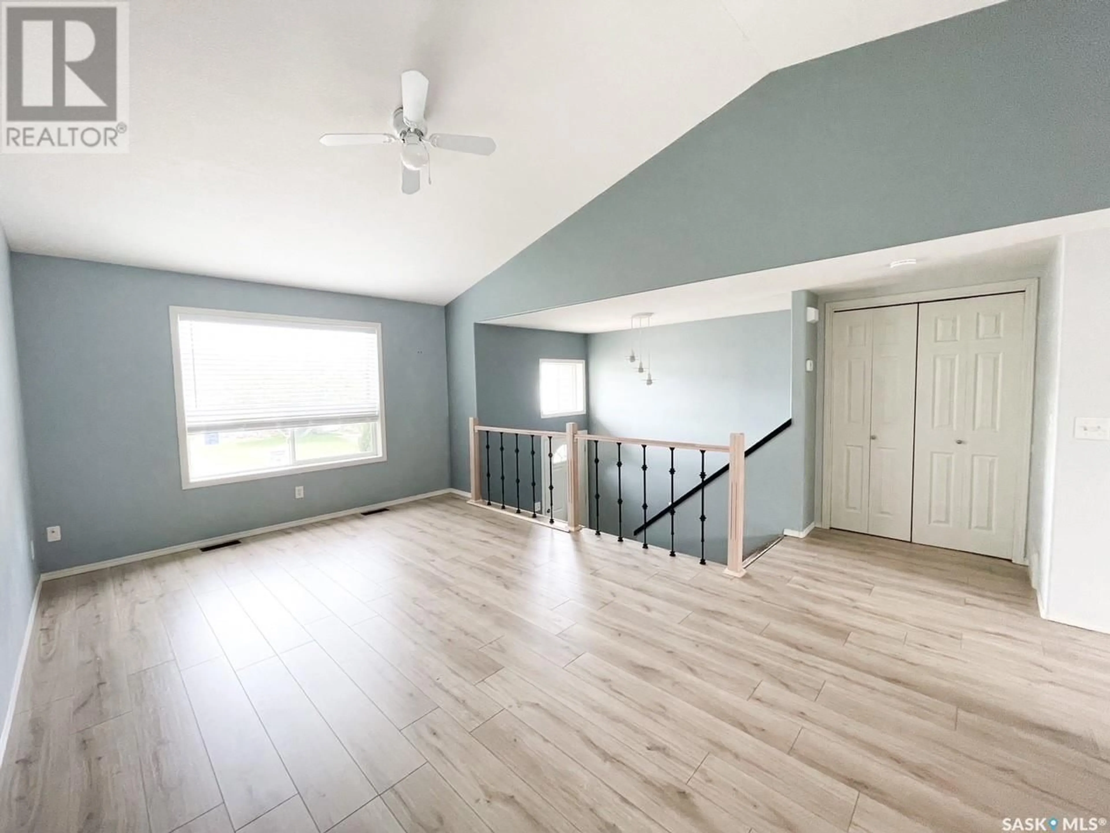 A pic of a room, wood floors for 3 3472 Fairlight DRIVE, Saskatoon Saskatchewan S7M3Z4