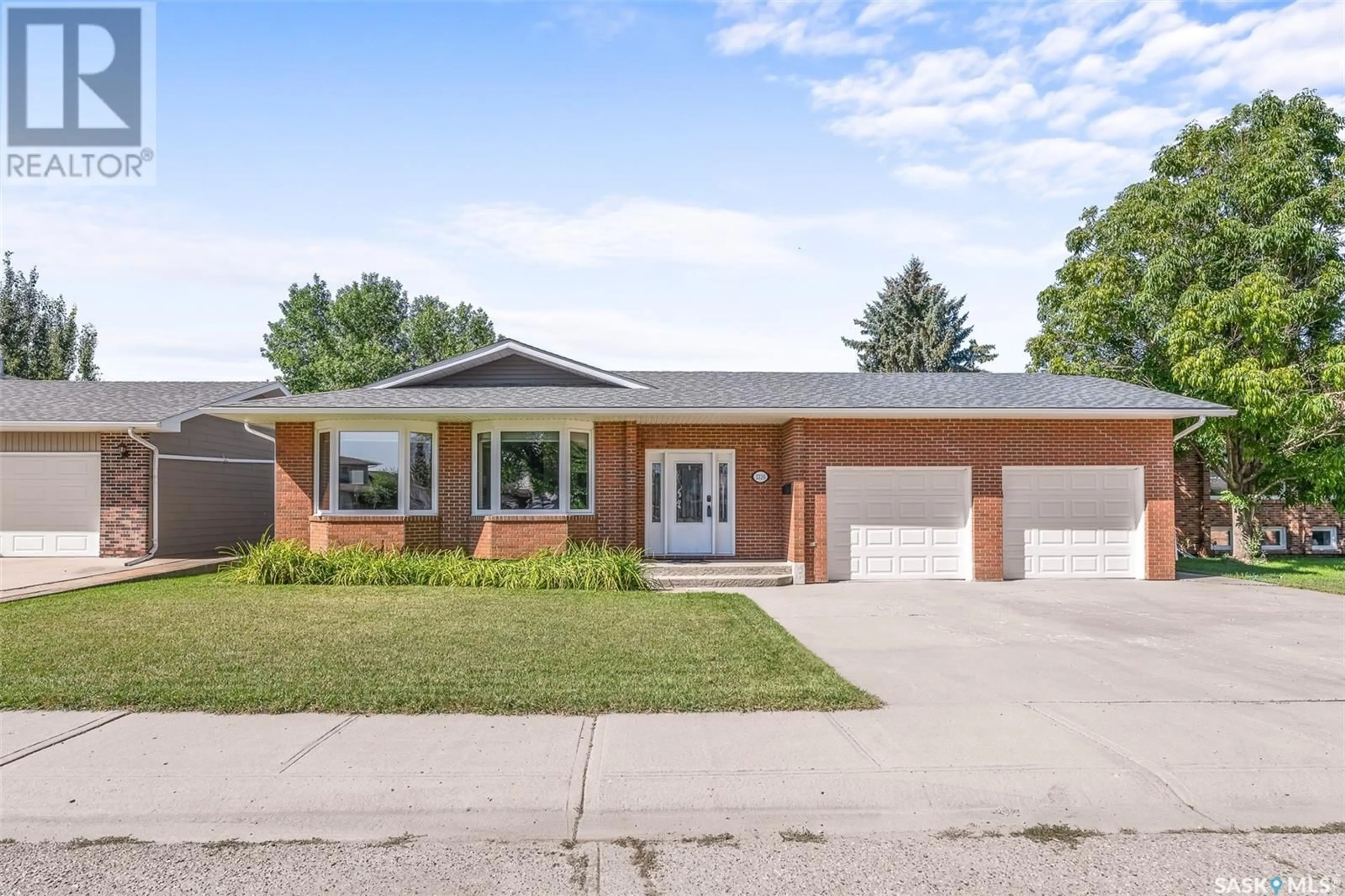 Home with brick exterior material for 1326 REGAL CRESCENT, Moose Jaw Saskatchewan S6H7S2