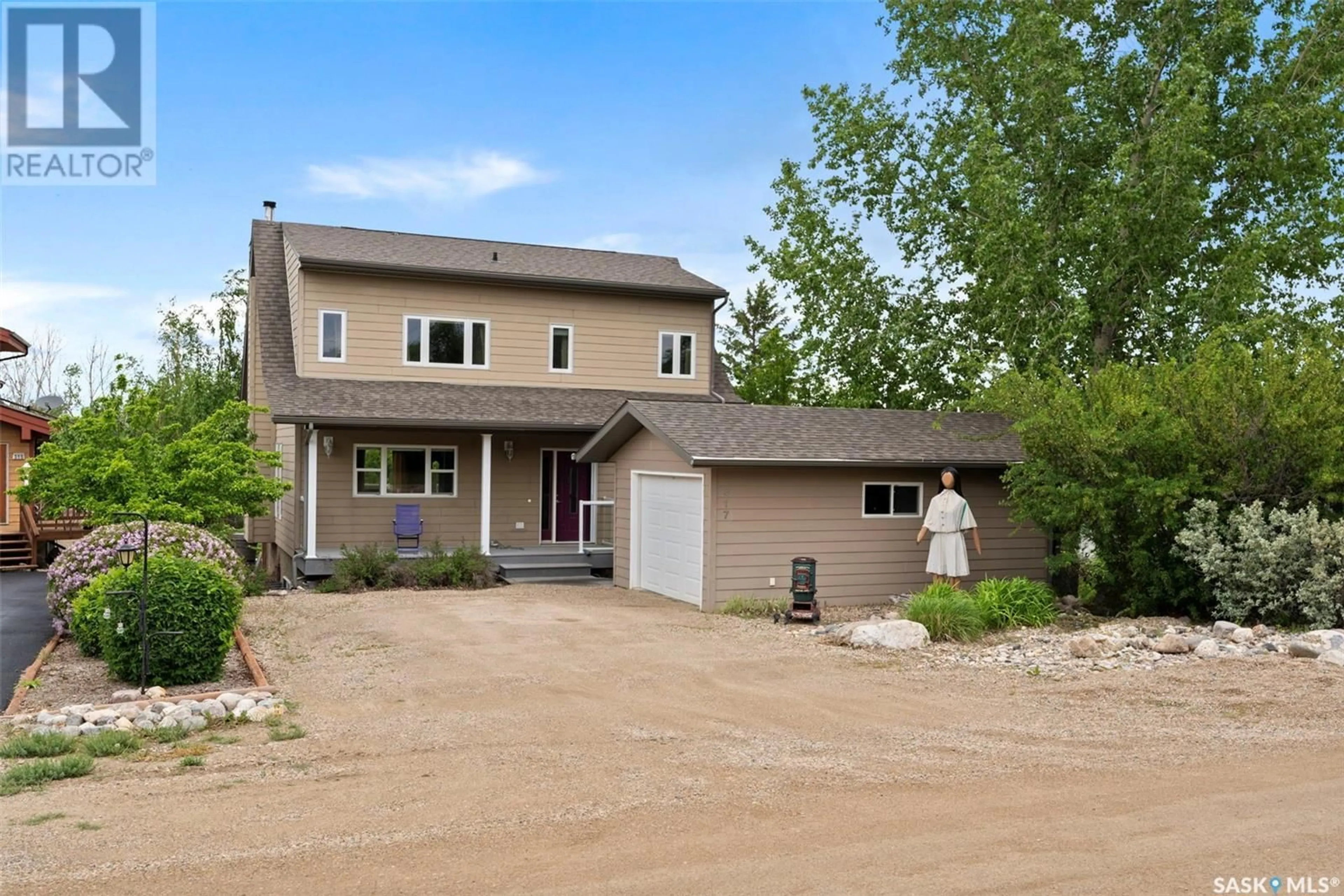 Frontside or backside of a home for 317 Cumming AVENUE, Manitou Beach Saskatchewan S0K4T1