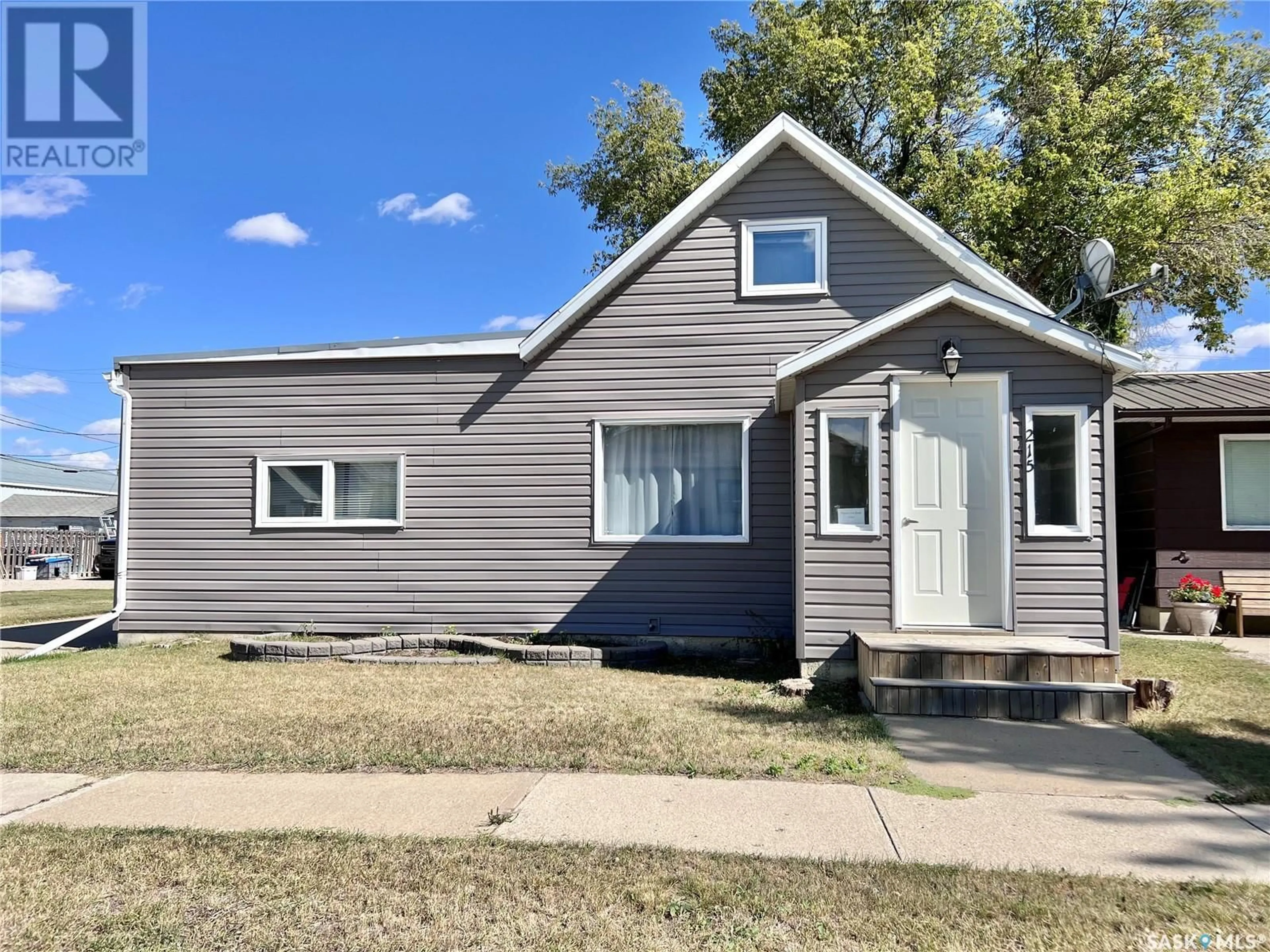 Frontside or backside of a home for 215 Simpson STREET, Outlook Saskatchewan S0L2N0