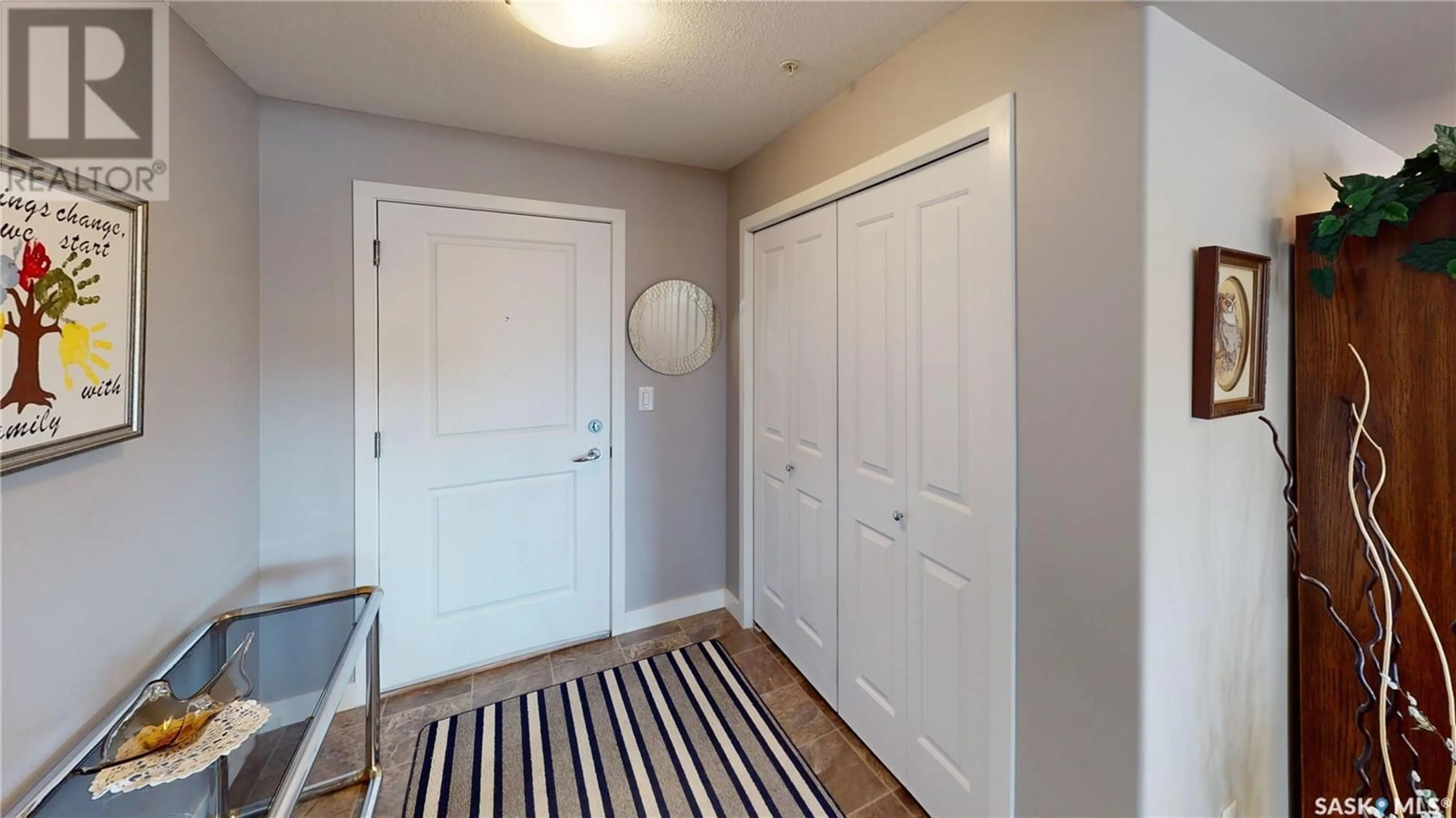 Indoor entryway, wood floors for 211 2311 Windsor Park ROAD, Regina Saskatchewan S4V1S2