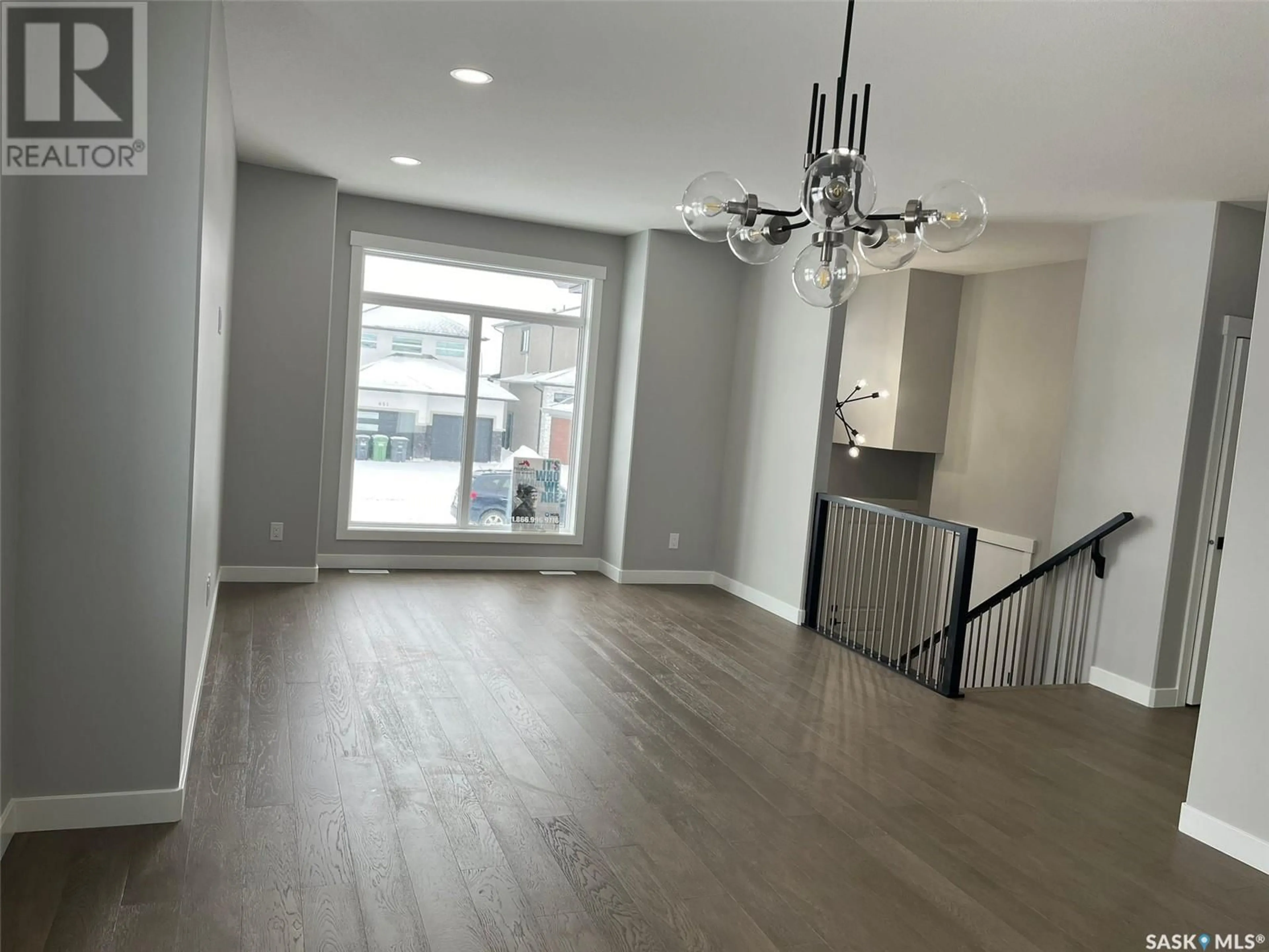 A pic of a room, wood floors for 154 Mazurek CRESCENT, Saskatoon Saskatchewan S7V1S2