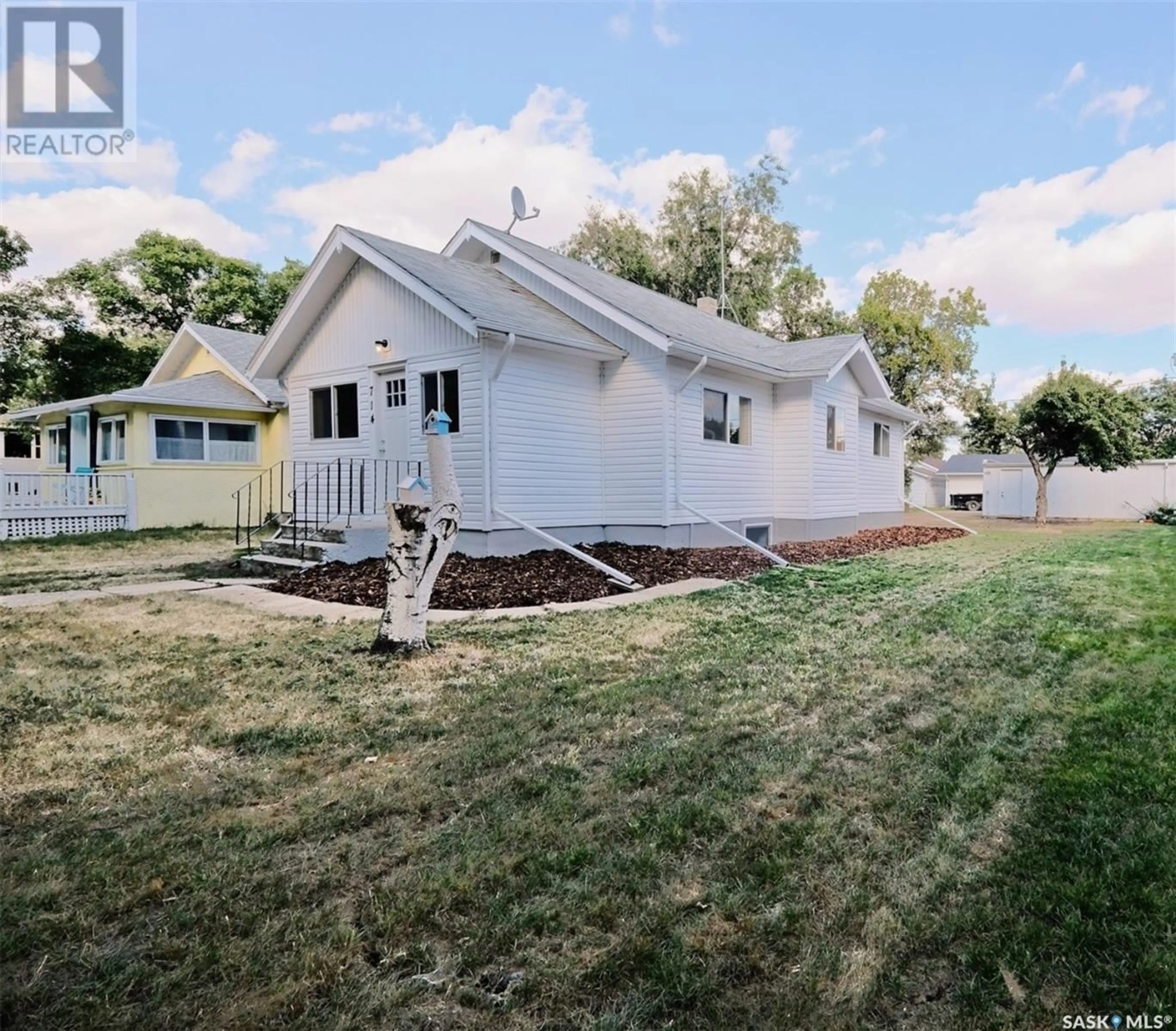 Frontside or backside of a home, the fenced backyard for 714 Main STREET, Rosetown Saskatchewan S0L2V0