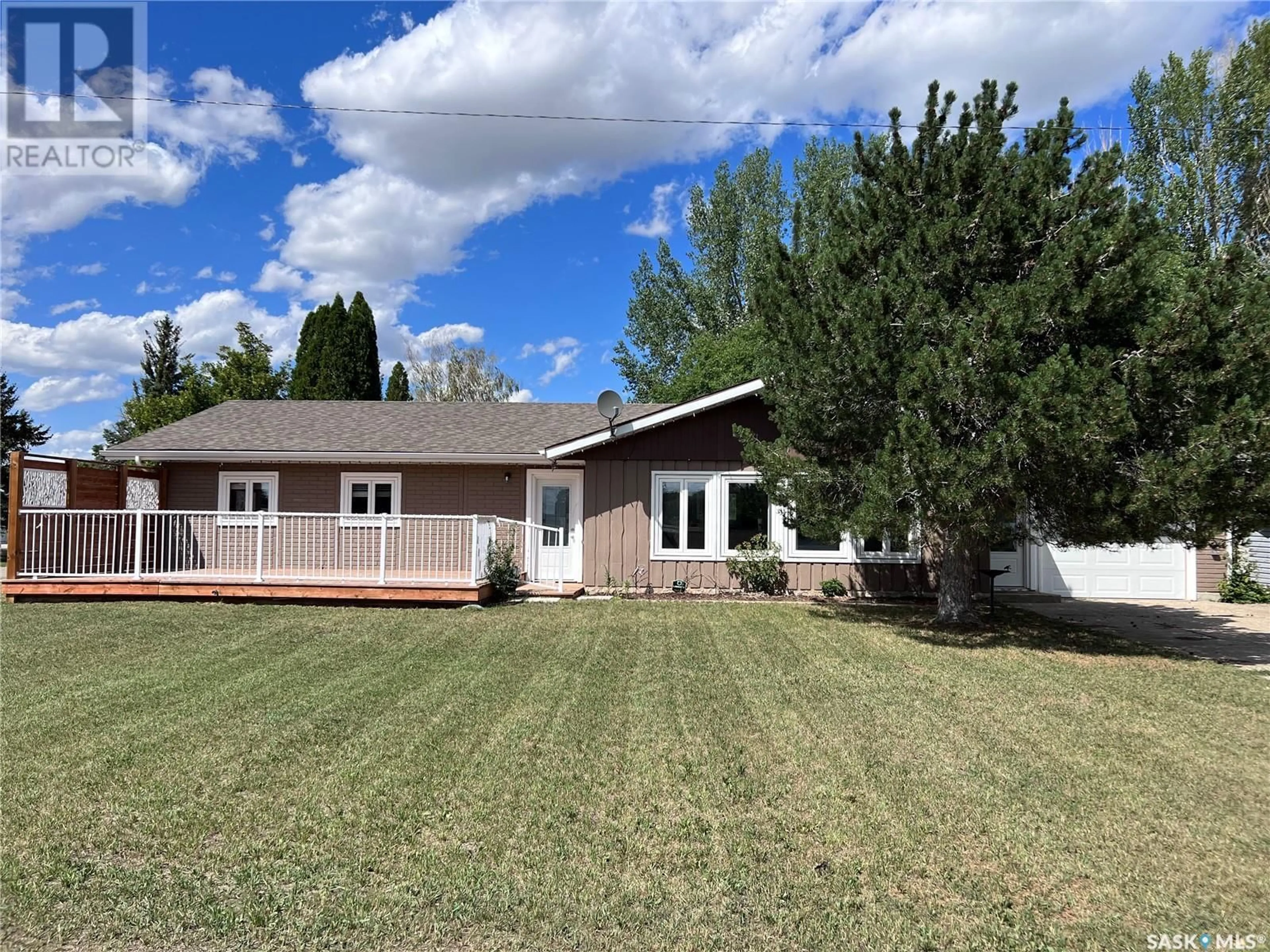 Frontside or backside of a home, the fenced backyard for 203 Cross STREET N, Outlook Saskatchewan S0L2N0